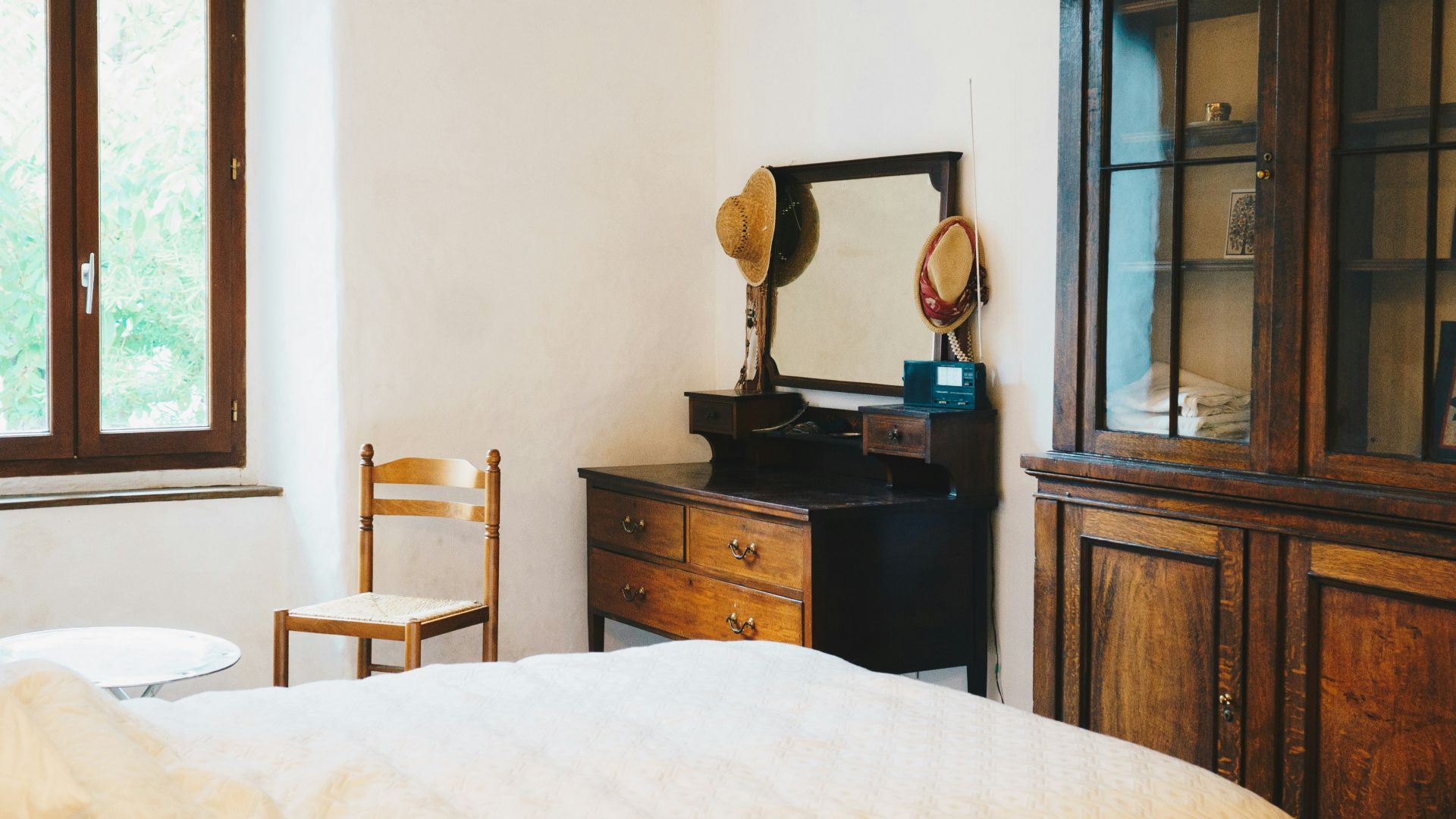 a room with a bed and a mirror