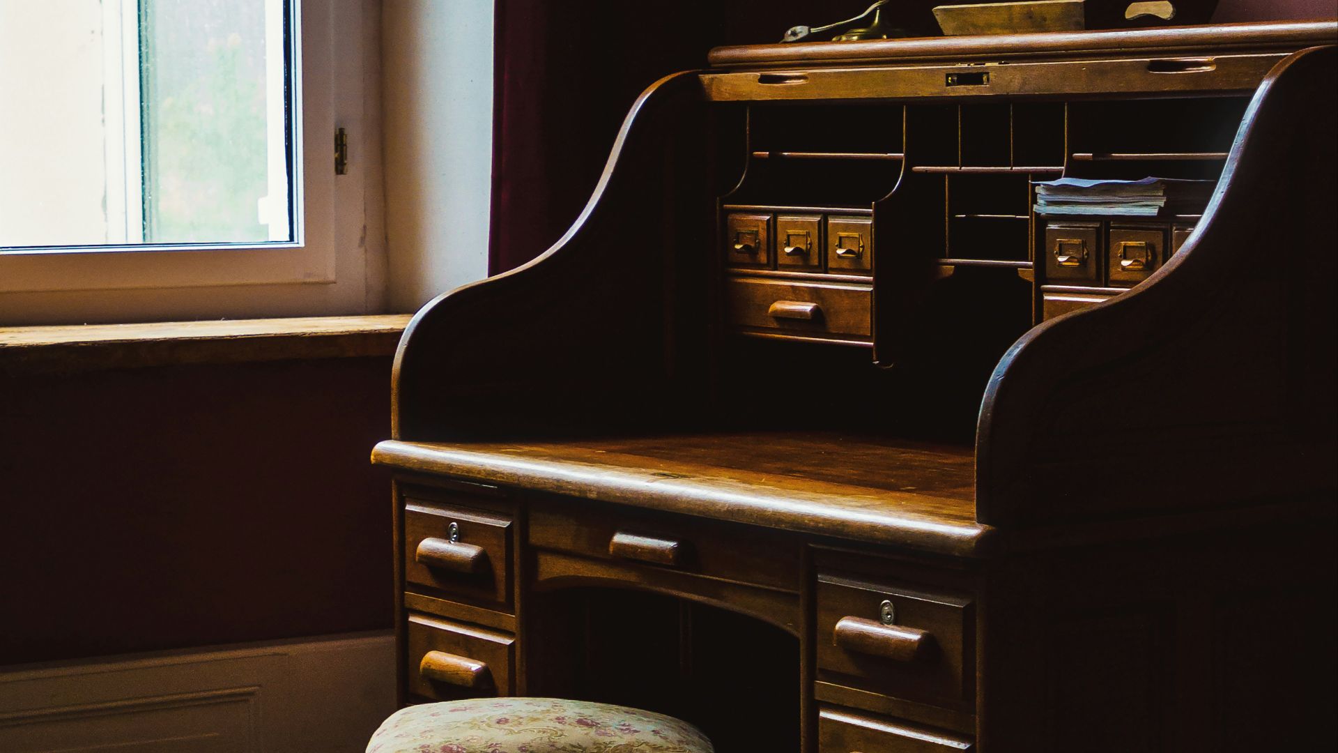 brown wooden desk with chair