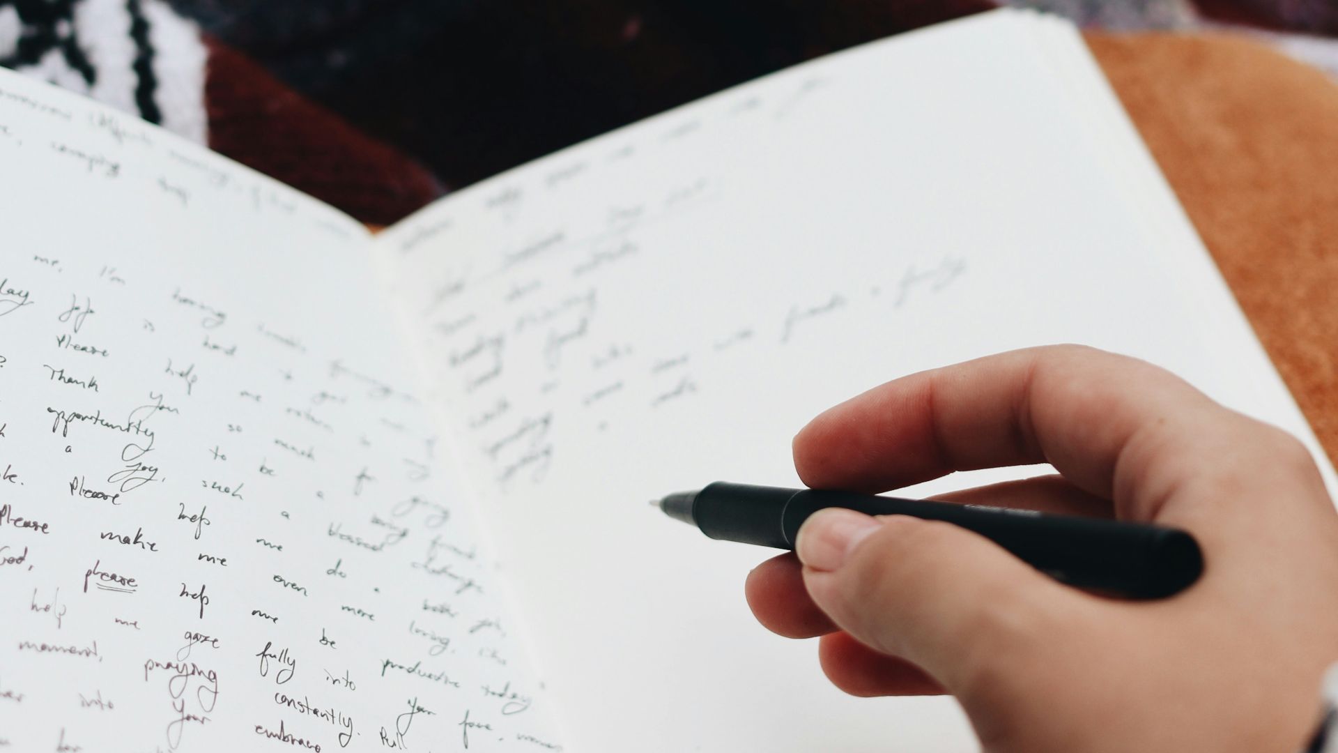 person writing on white paper