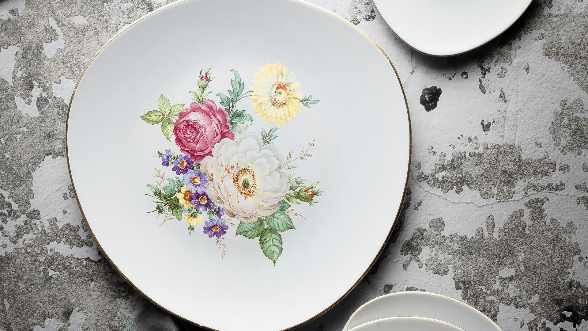 white pink and green floral round ceramic plate