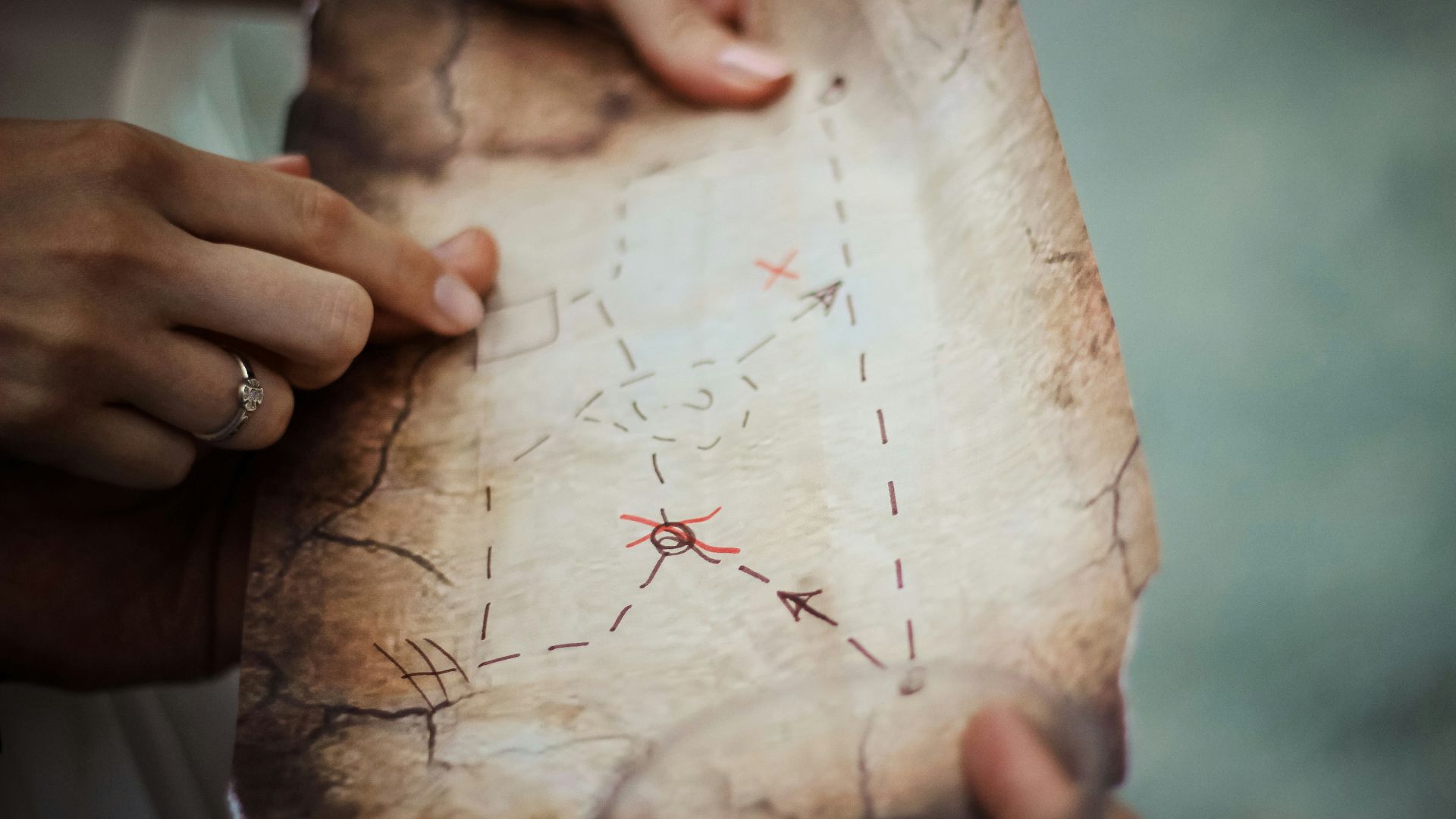 person holding brown map