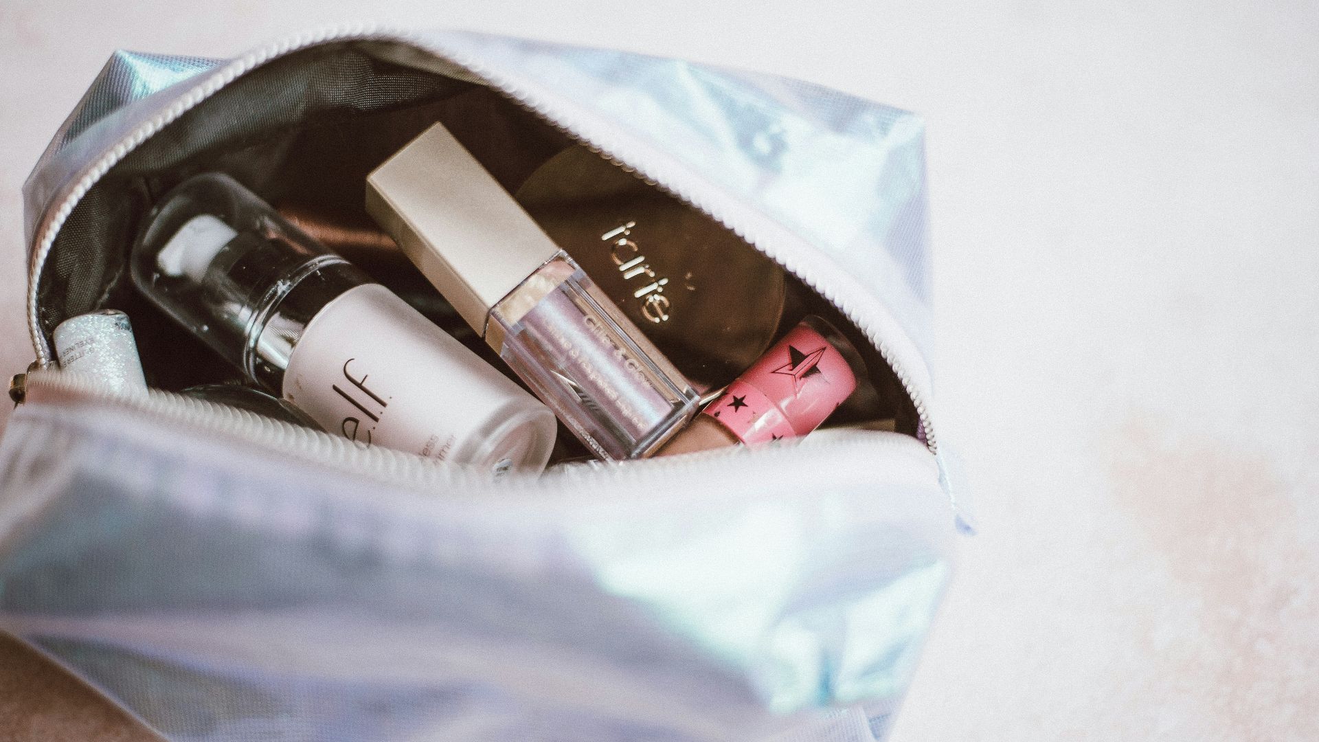 cosmetics in gray bag