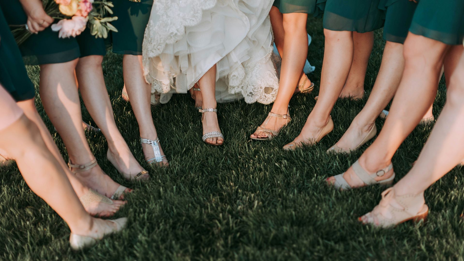 photography of womens on green grass during daytime