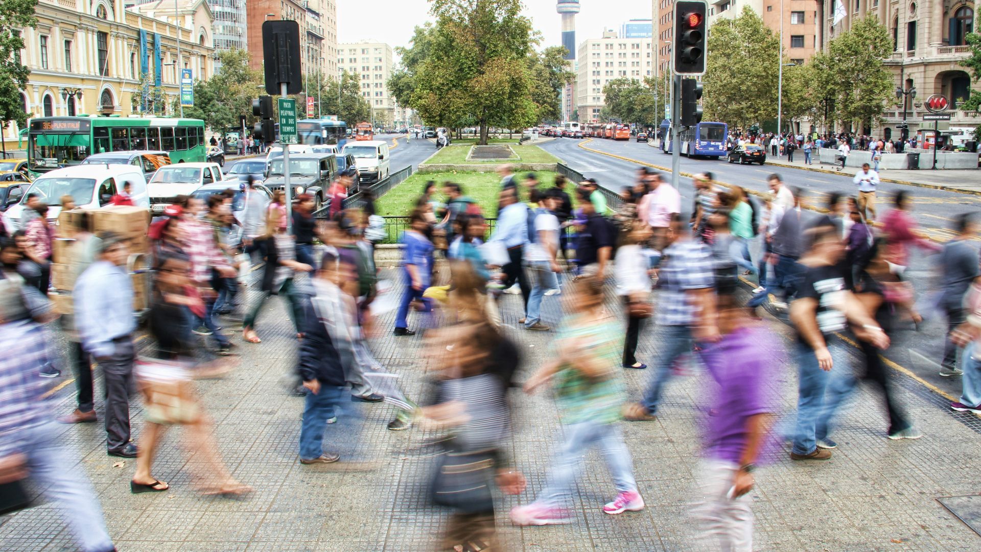 timelapse photo of people passing the street