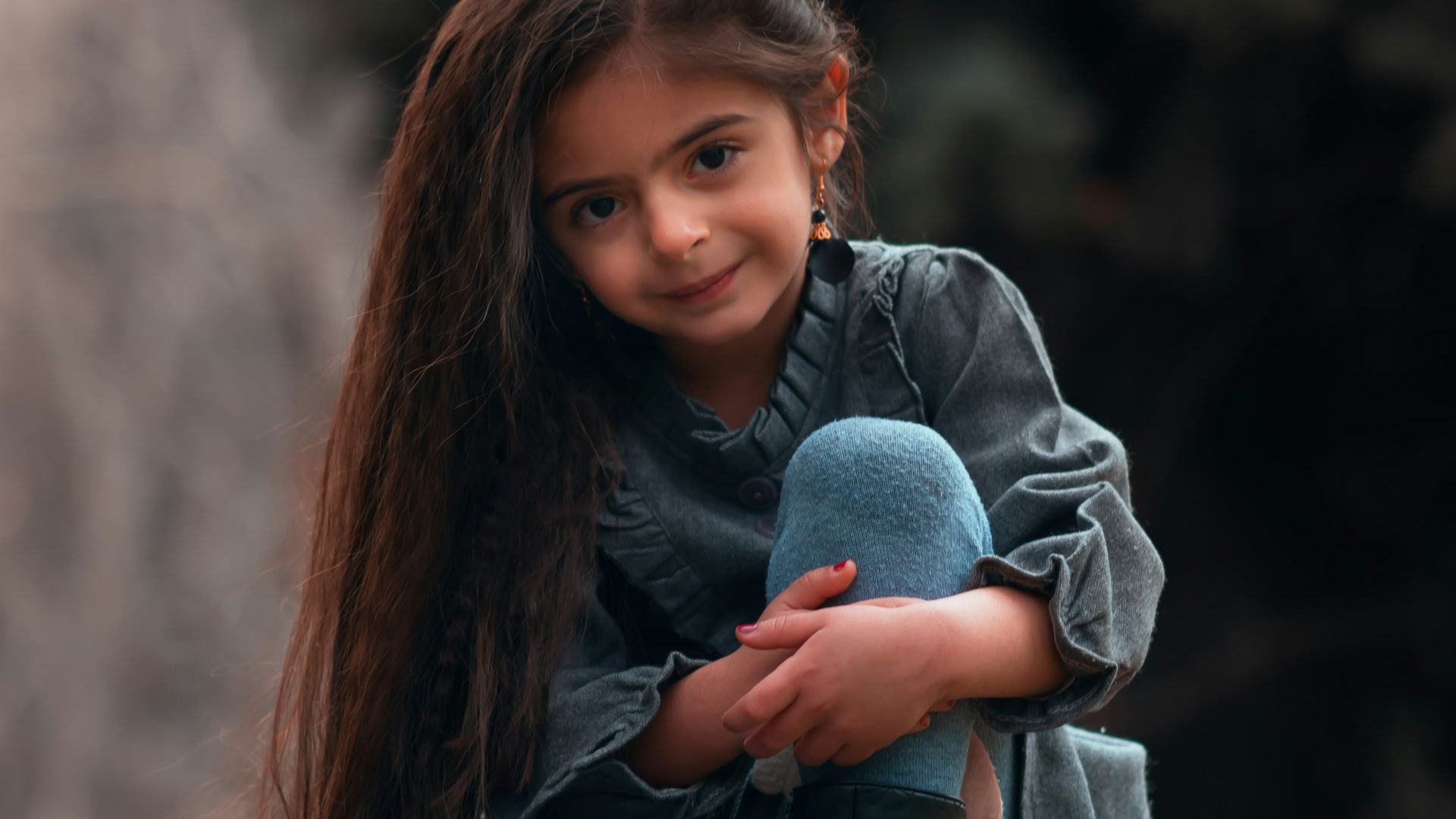 girl sitting on rock