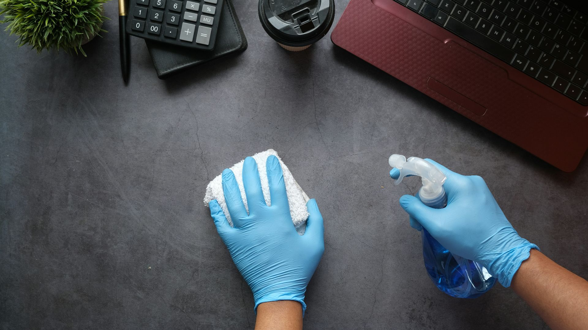 person in blue long sleeve shirt sitting beside black laptop computer