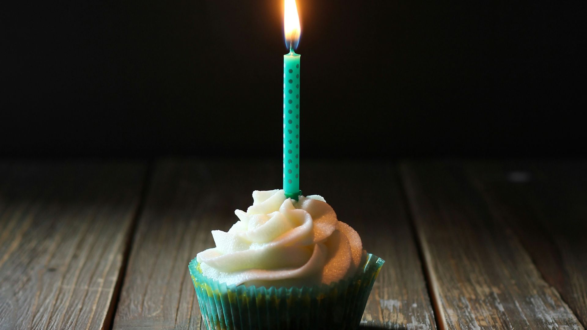 taper candle on cupcake