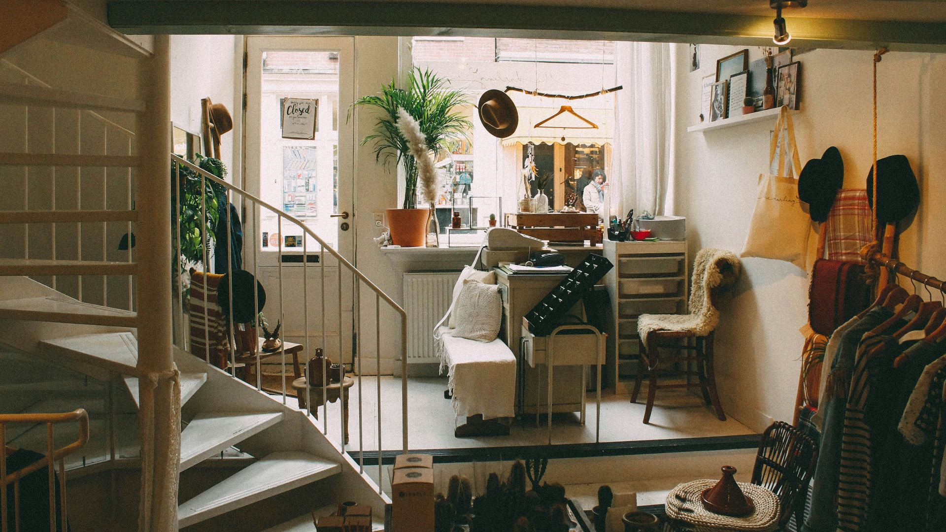 empty spiral staircase near white wooden door
