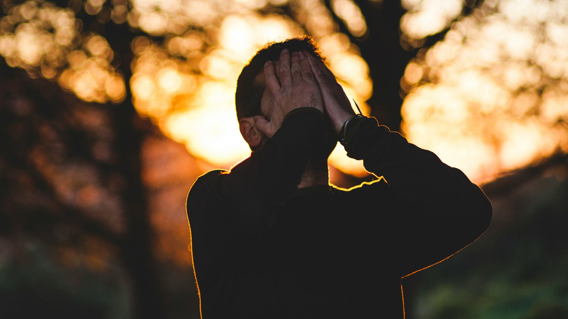 man wearing black long-sleeved shirt