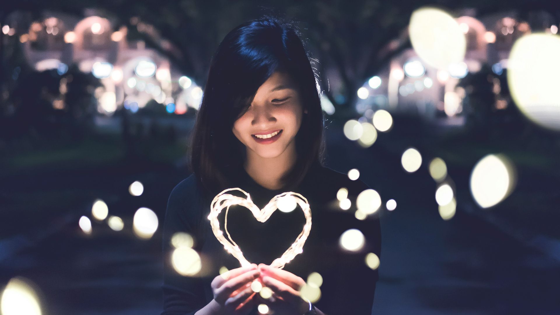 A woman holding a heart