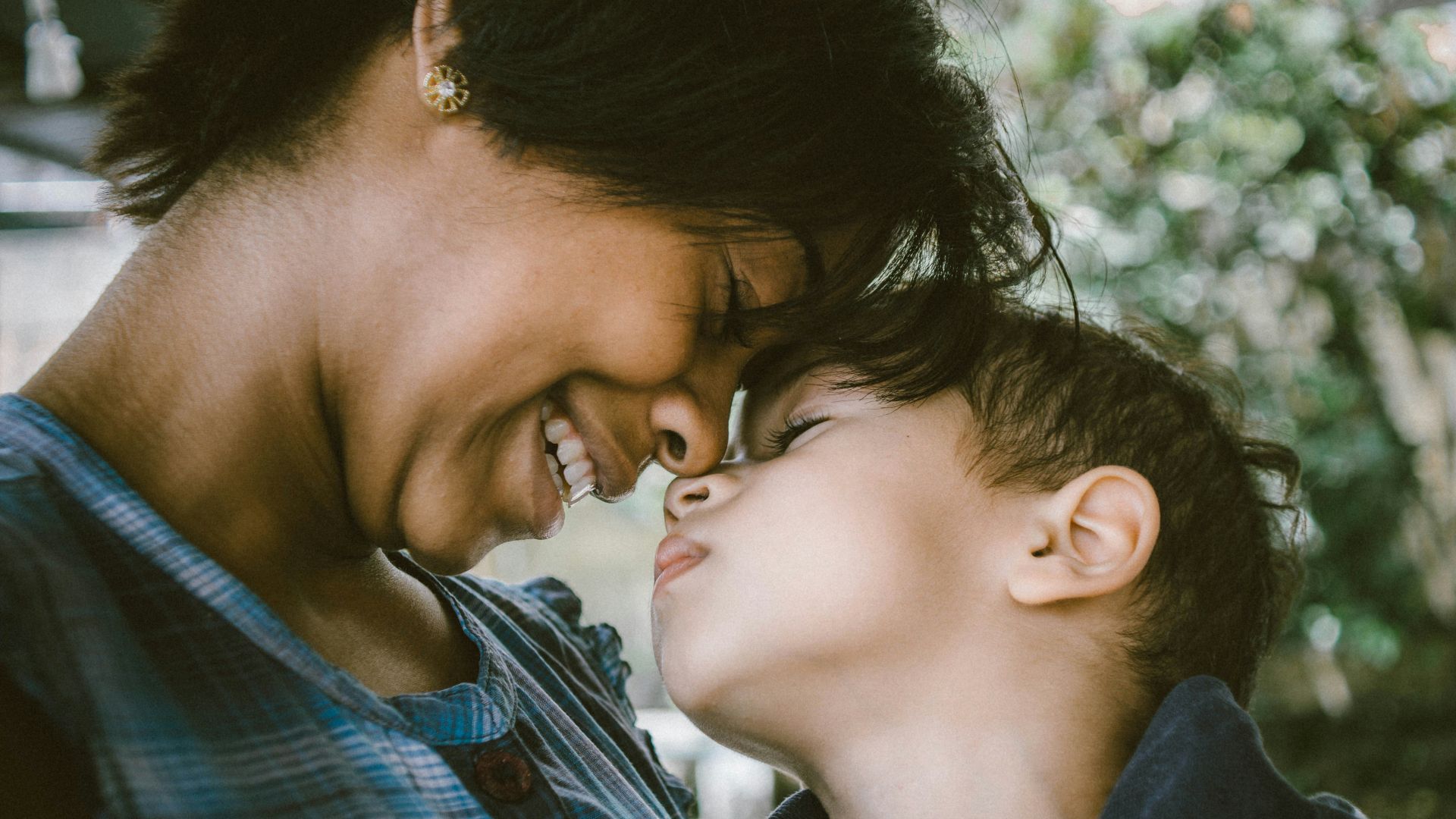 selective focus photography of woman and boy