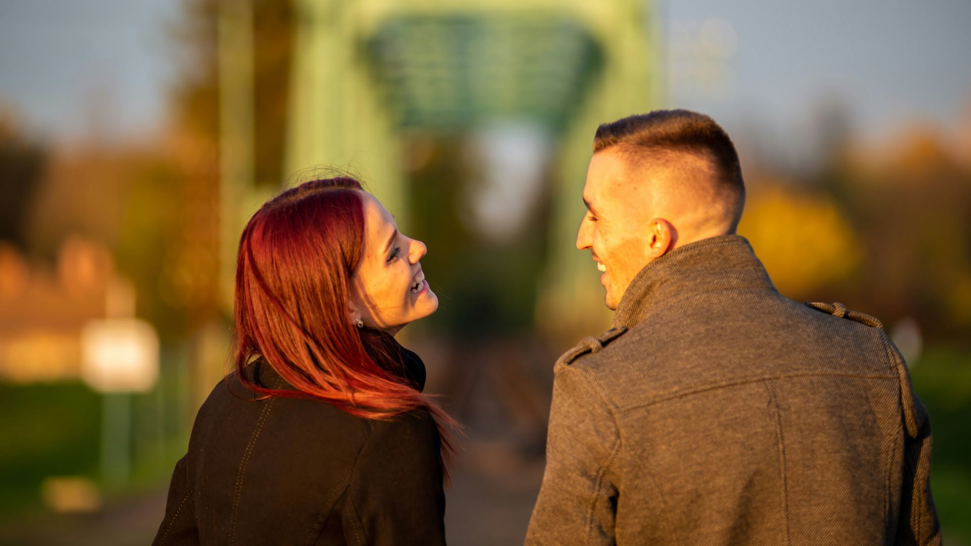 man and woman standing side by side during daytime