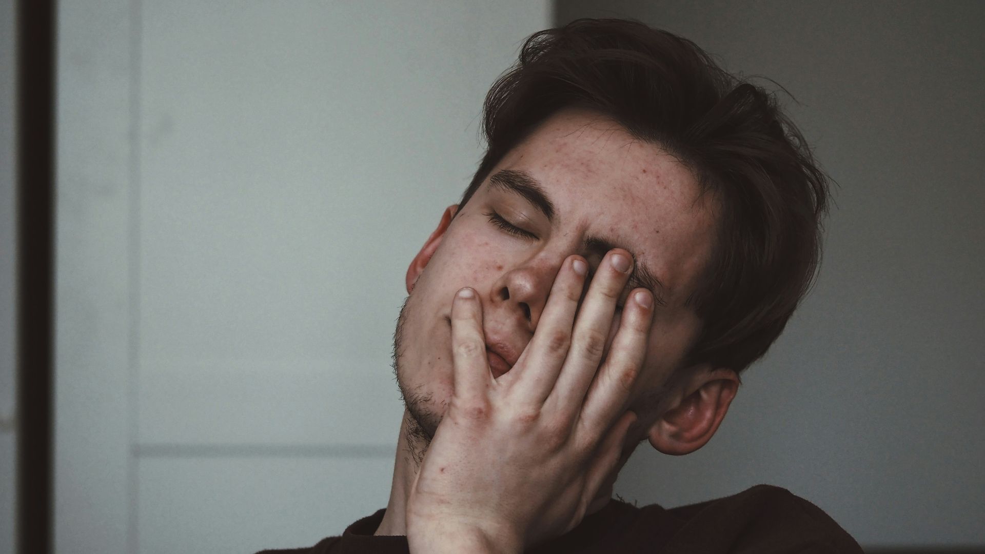 man wearing black crew-neck top