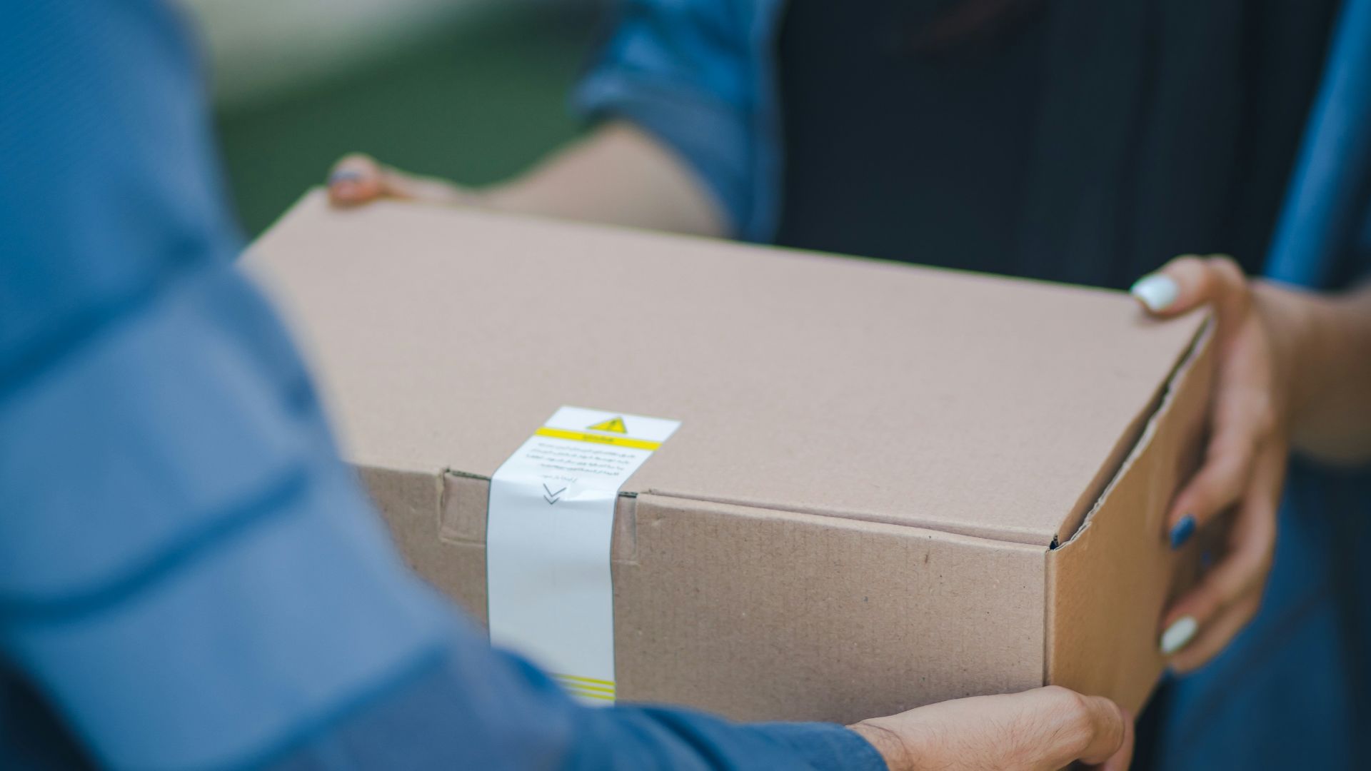 person giving brown box