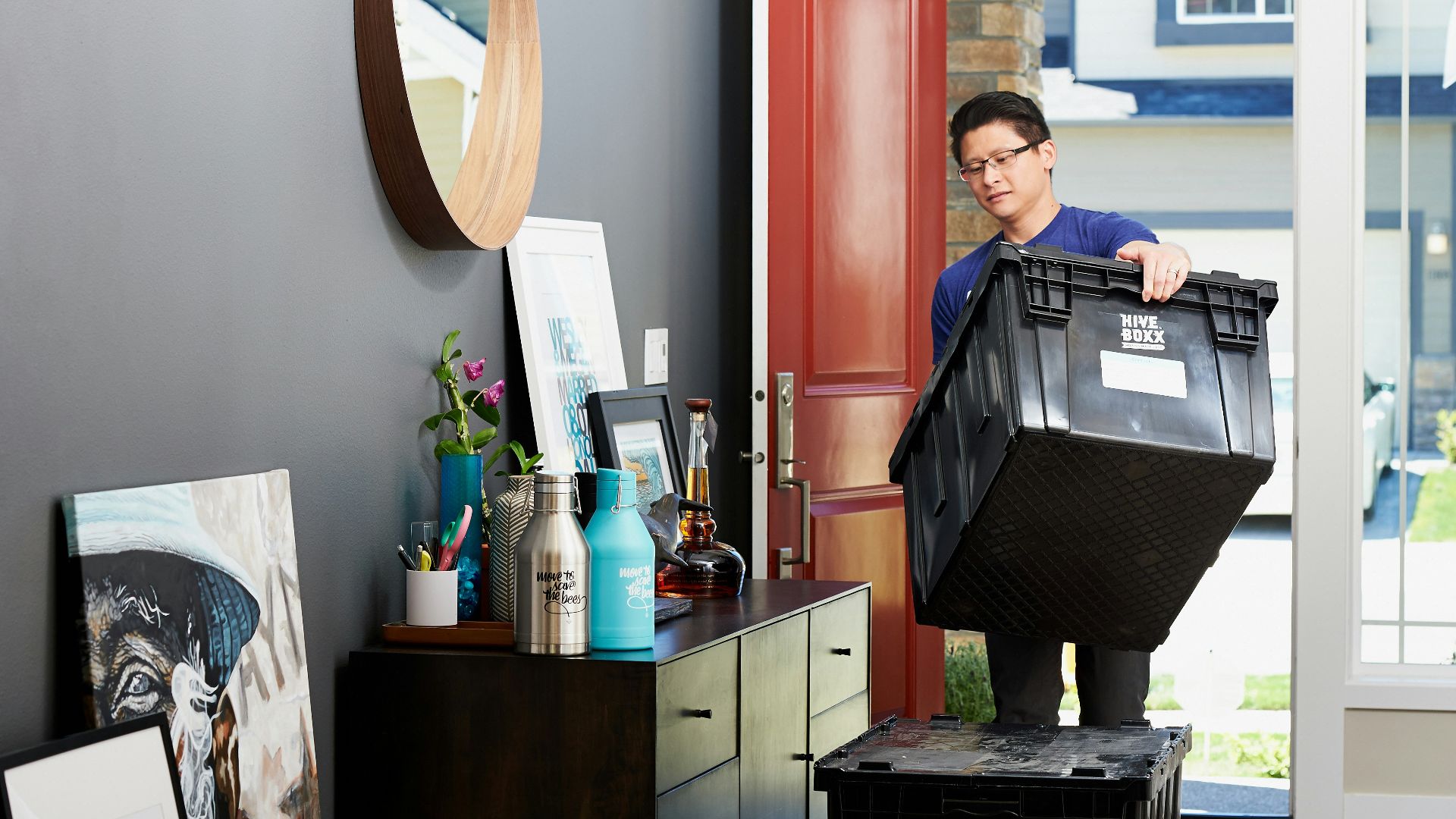 man in blue polo shirt sitting on chair