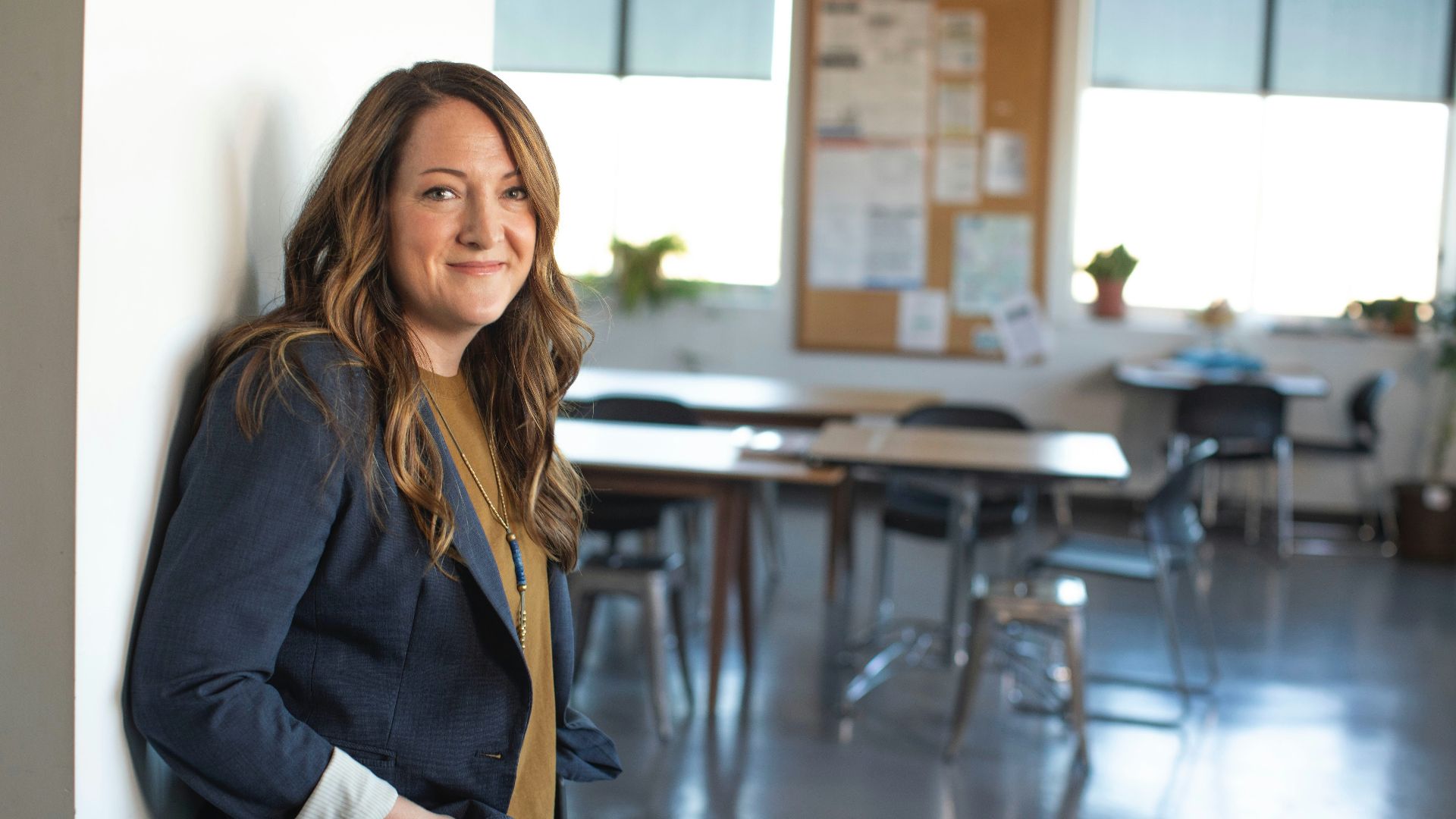 woman in black coat sitting on chair