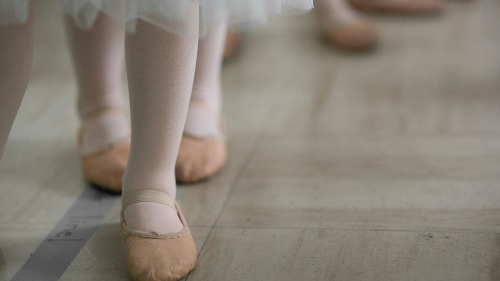 woman in white skirt and brown leather boots