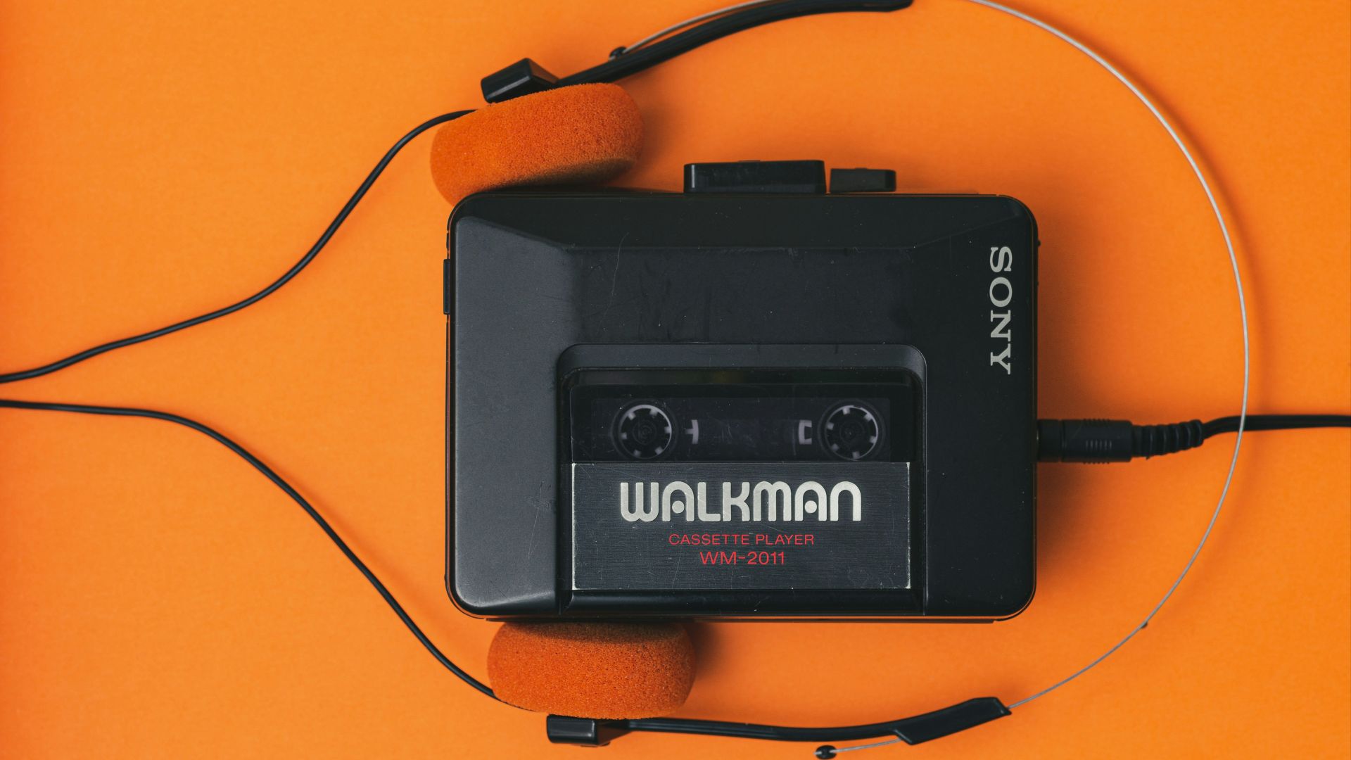 a cassette player with headphones attached to it