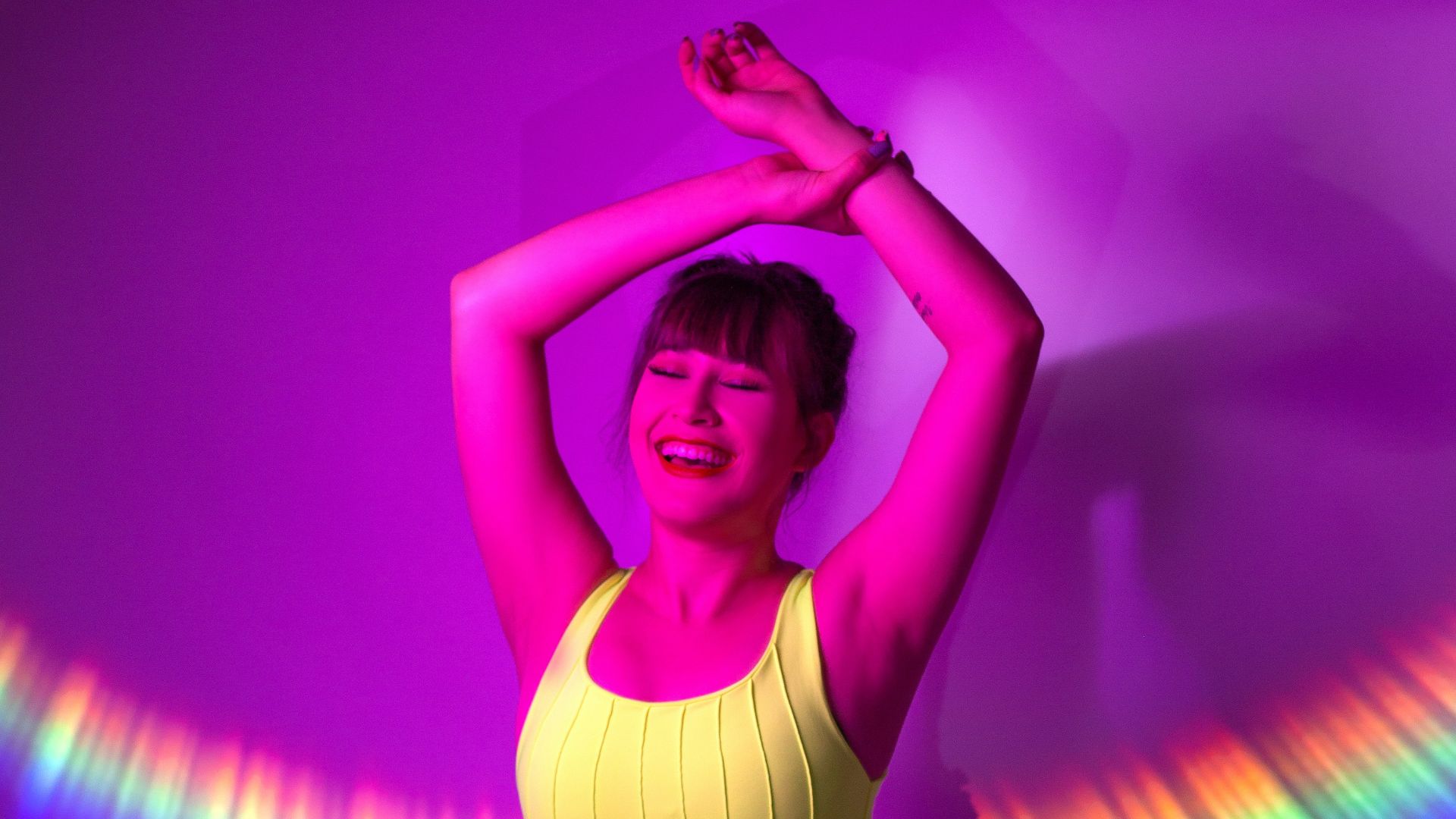 woman in white tank top and blue denim shorts