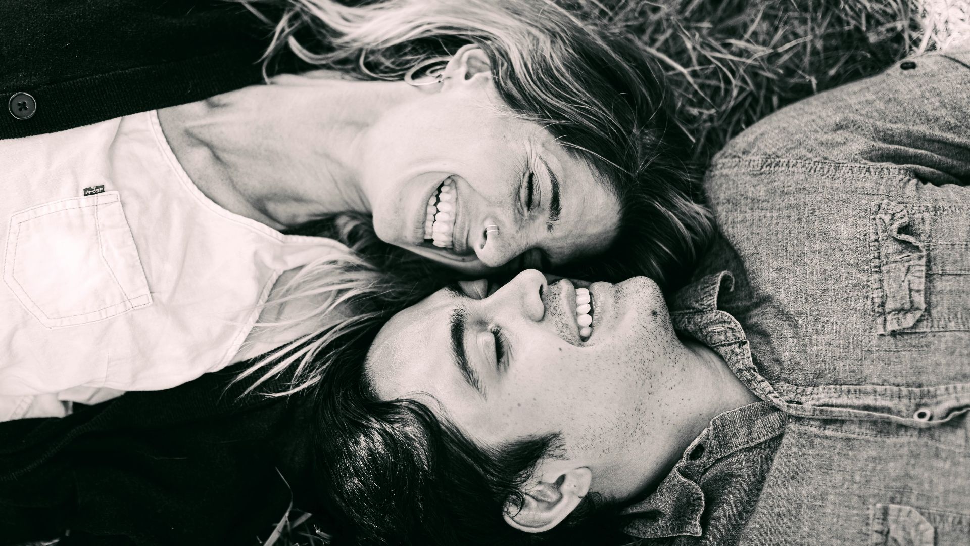 woman in white shirt lying on the ground