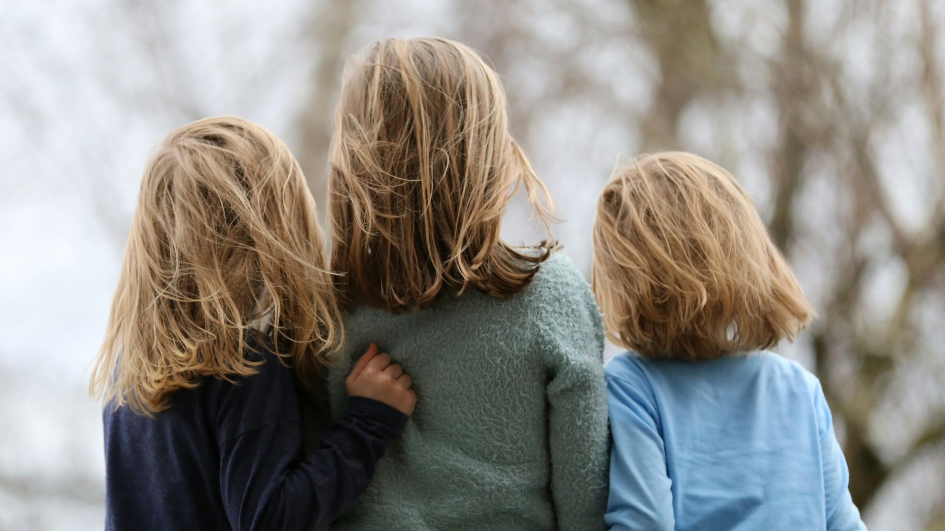 2 women in blue and gray sweaters