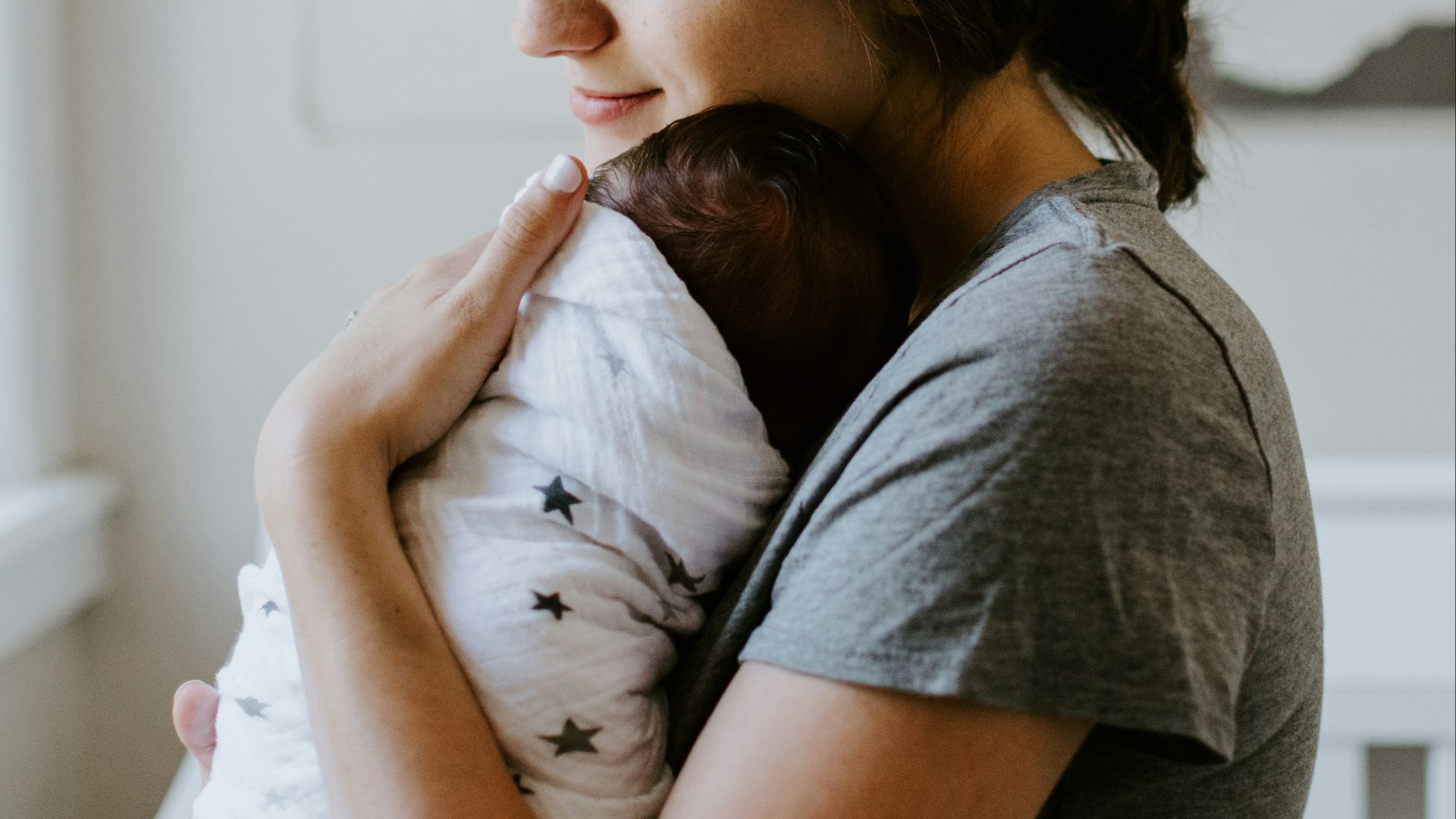 mother carrying baby