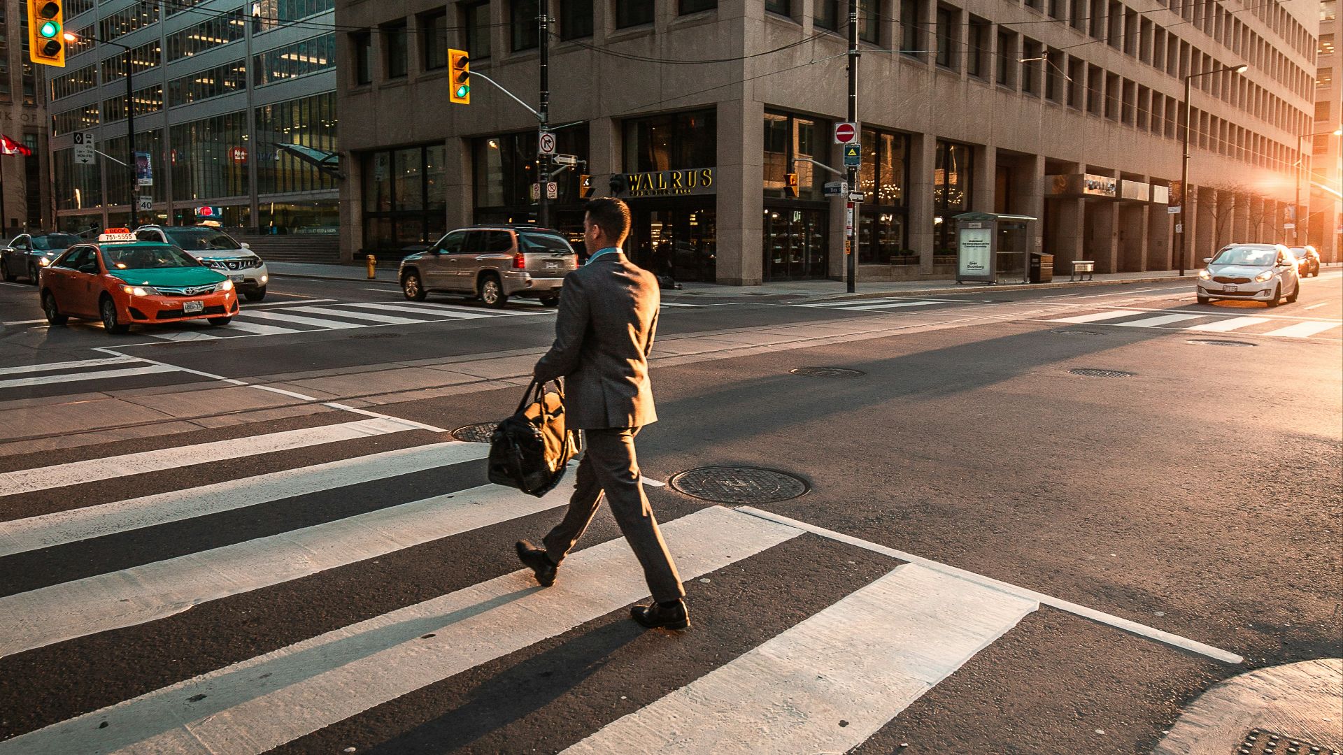 man crossing pedestrian lane