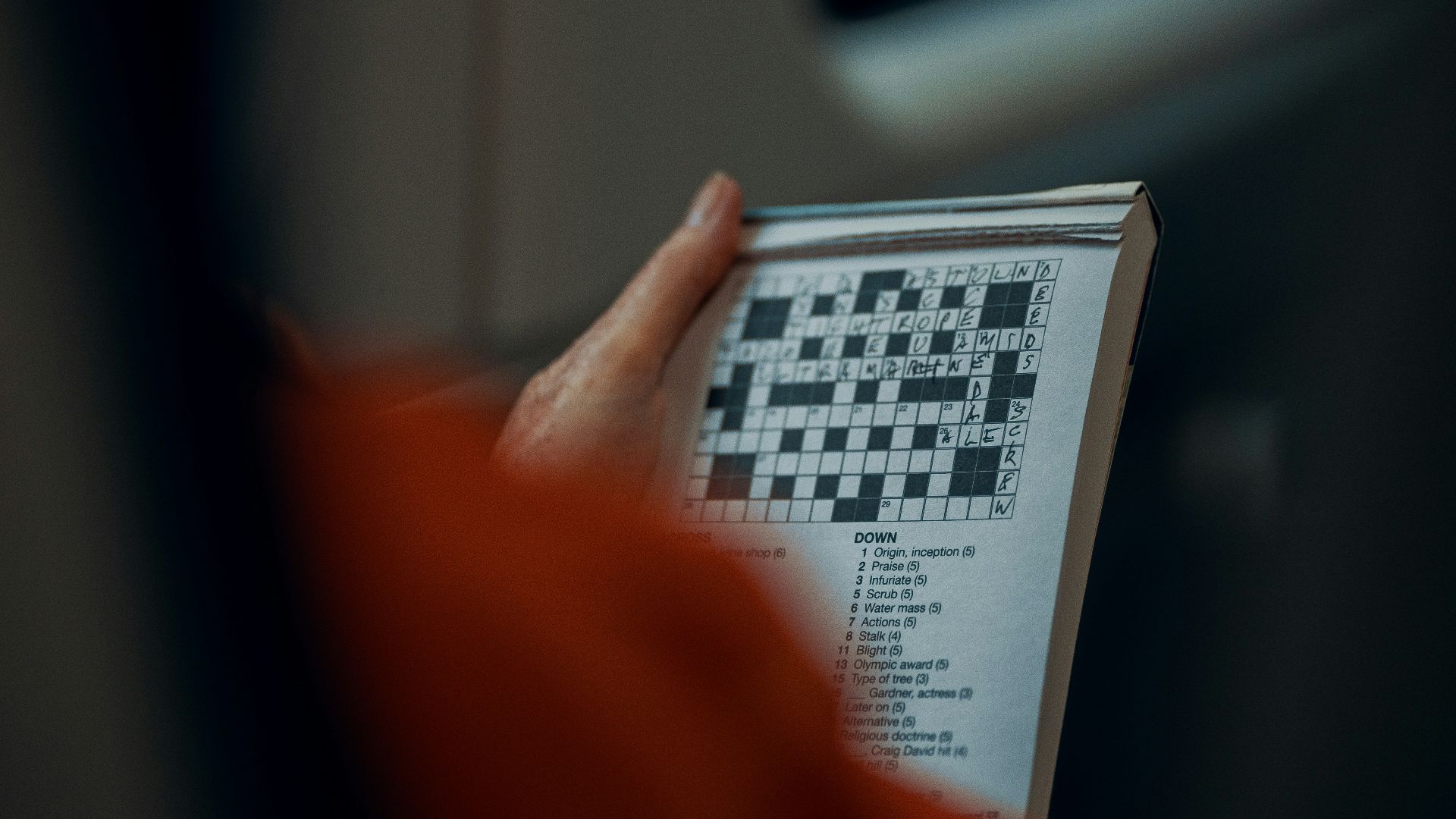 person holding white and black paper