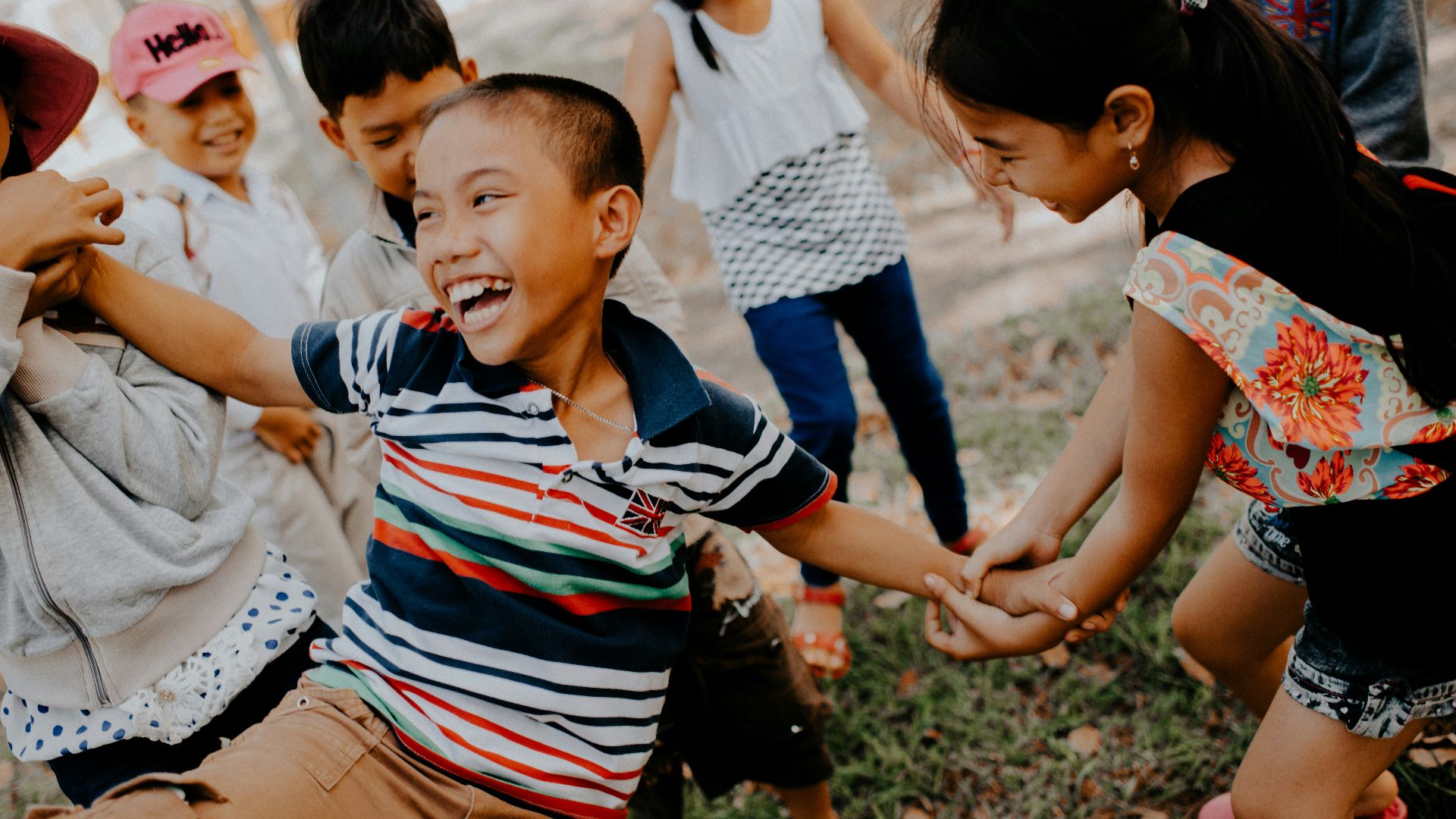 children playing on grass field