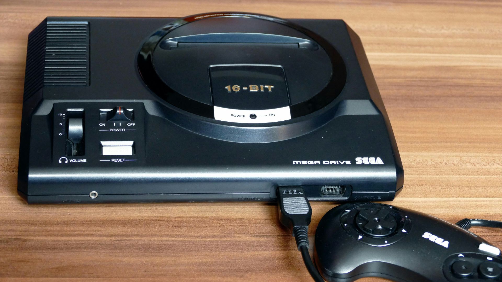a video game system sitting on top of a wooden table