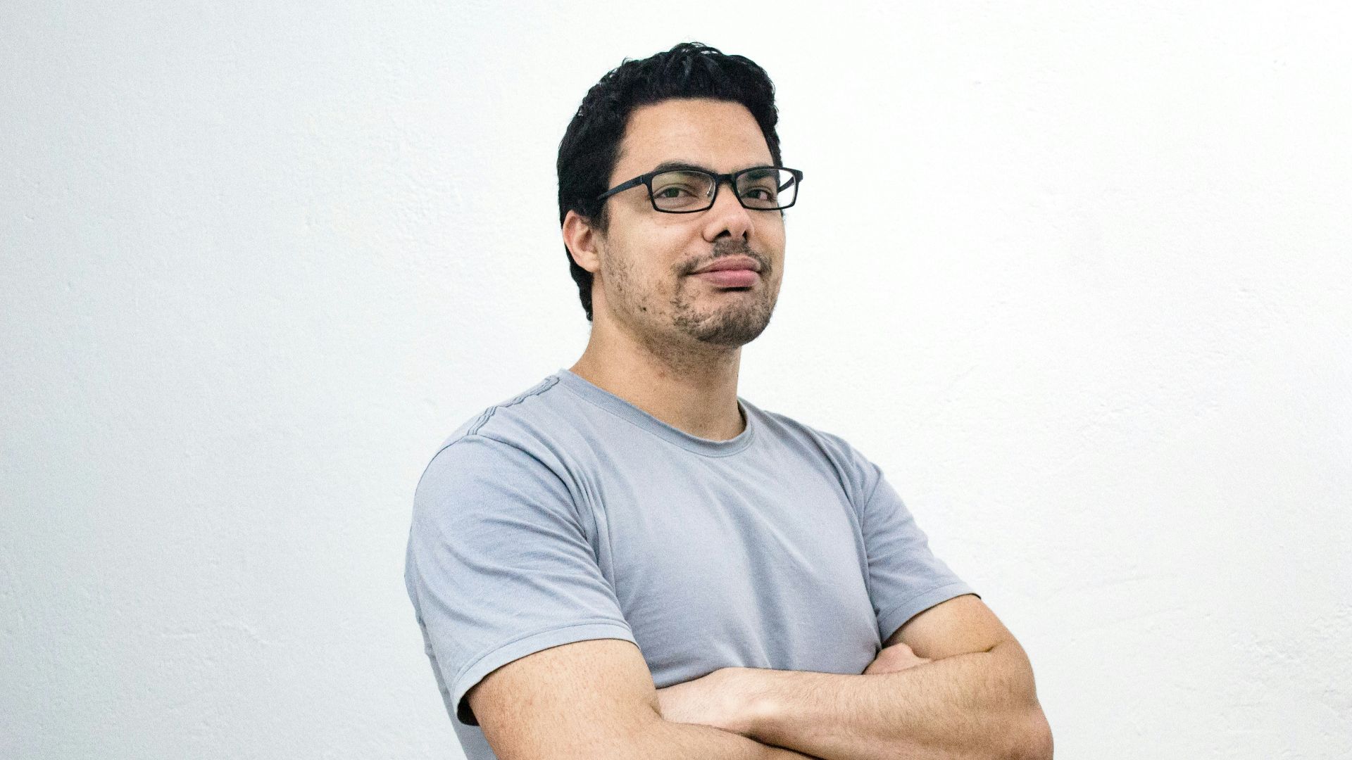 man crossing both arms