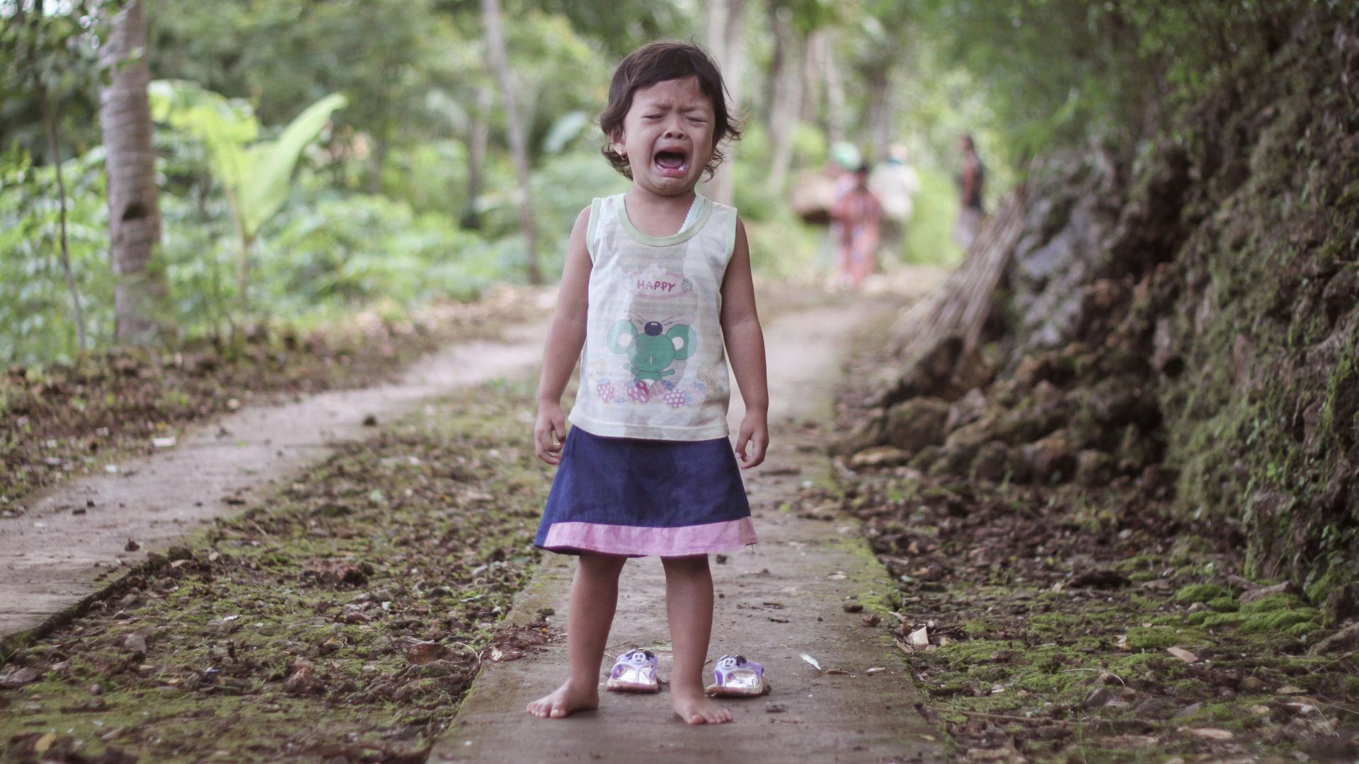 toddler girl wears white tank top