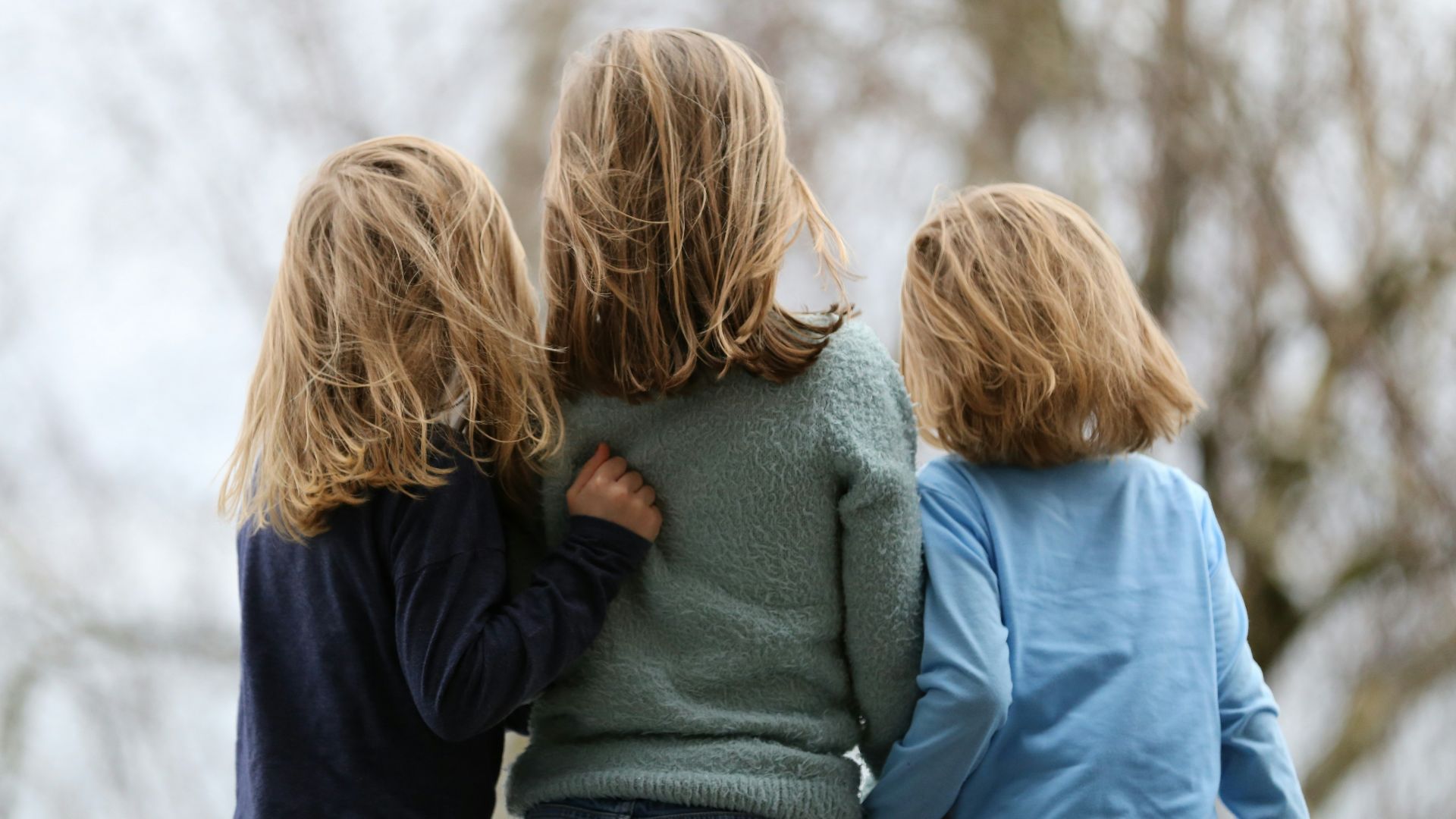 2 women in blue and gray sweaters