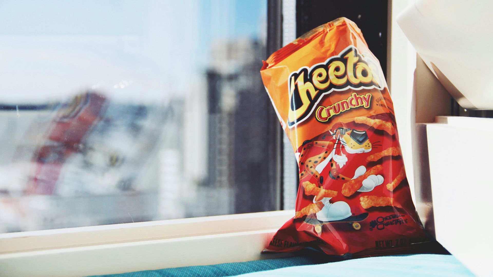 orange and yellow plastic pack on white table