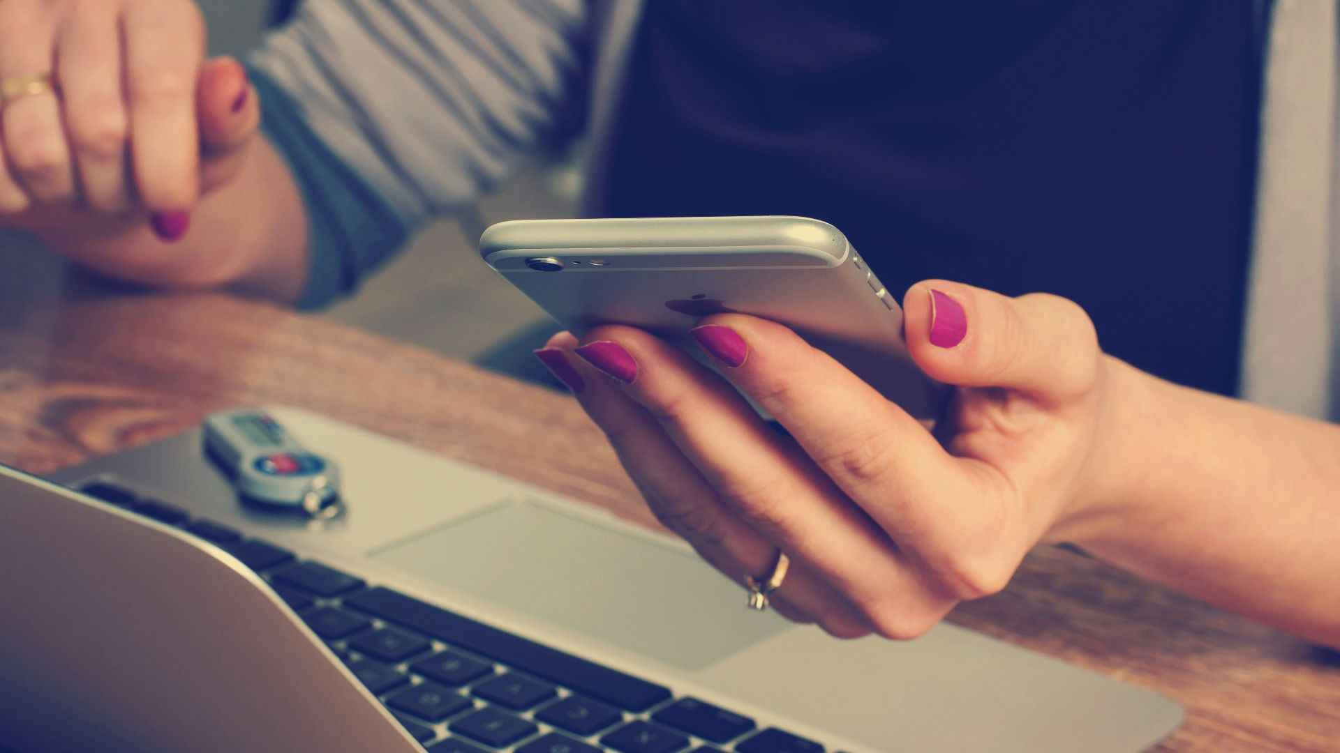 woman holding silver iPhone 6