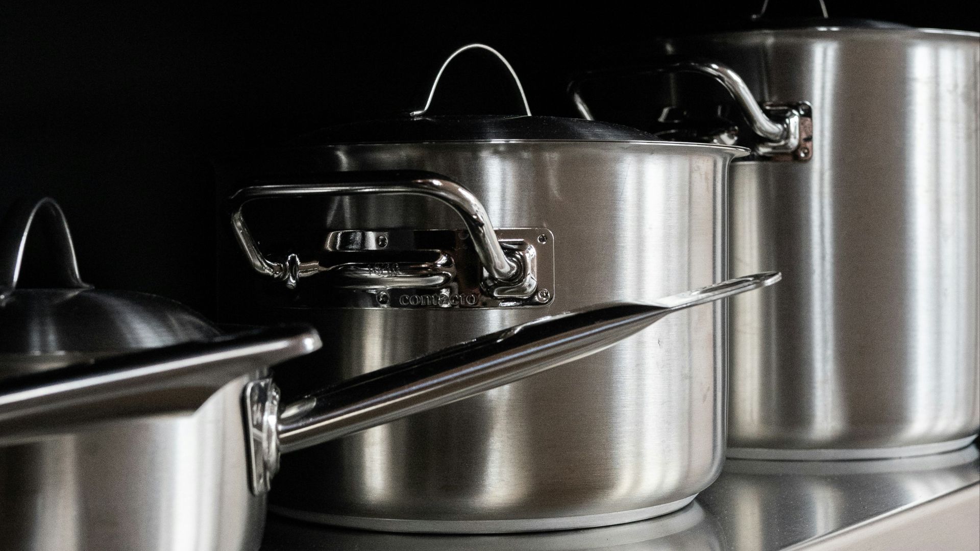 stainless steel cooking pots on stainless steel tray