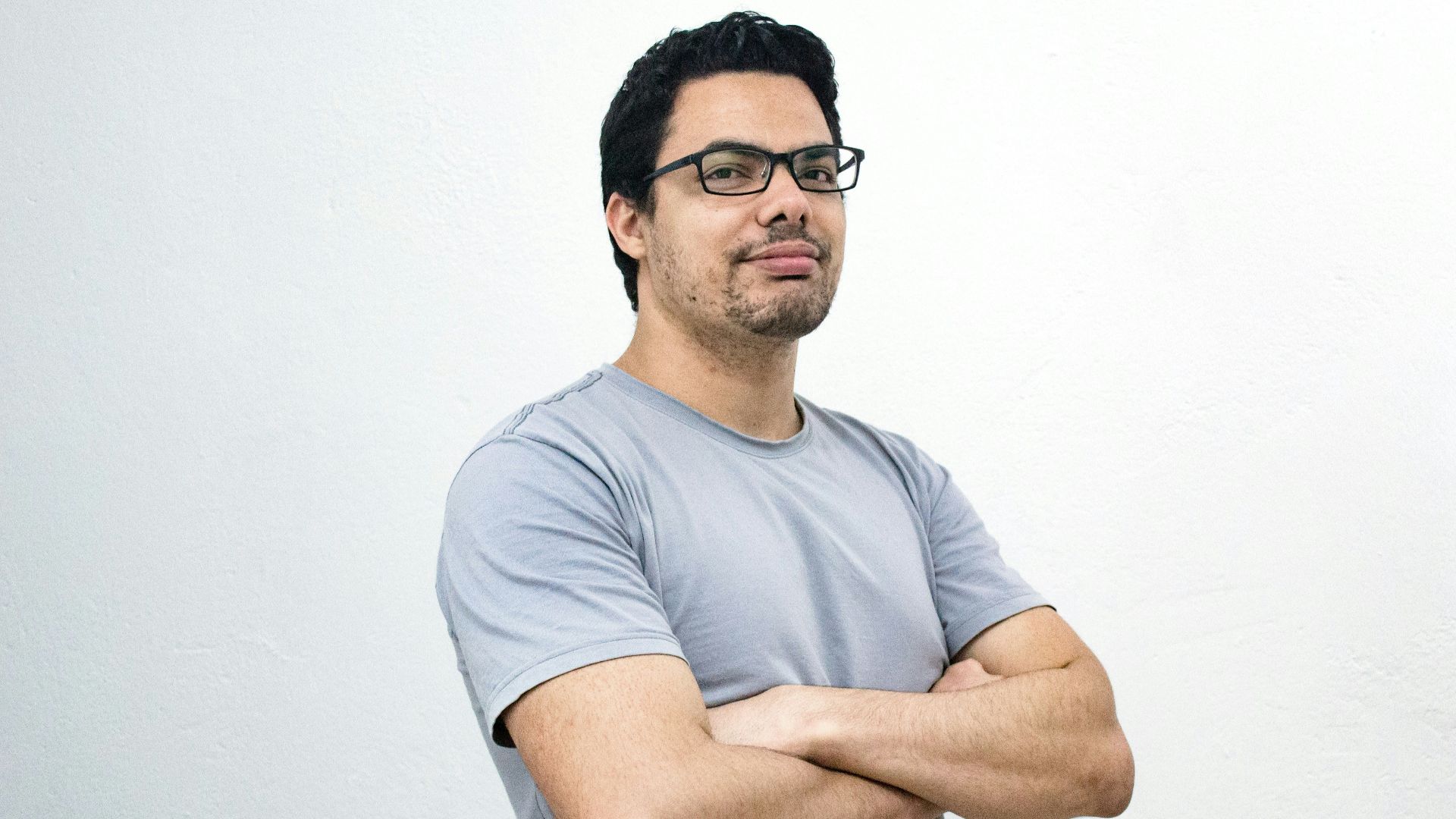 man crossing both arms