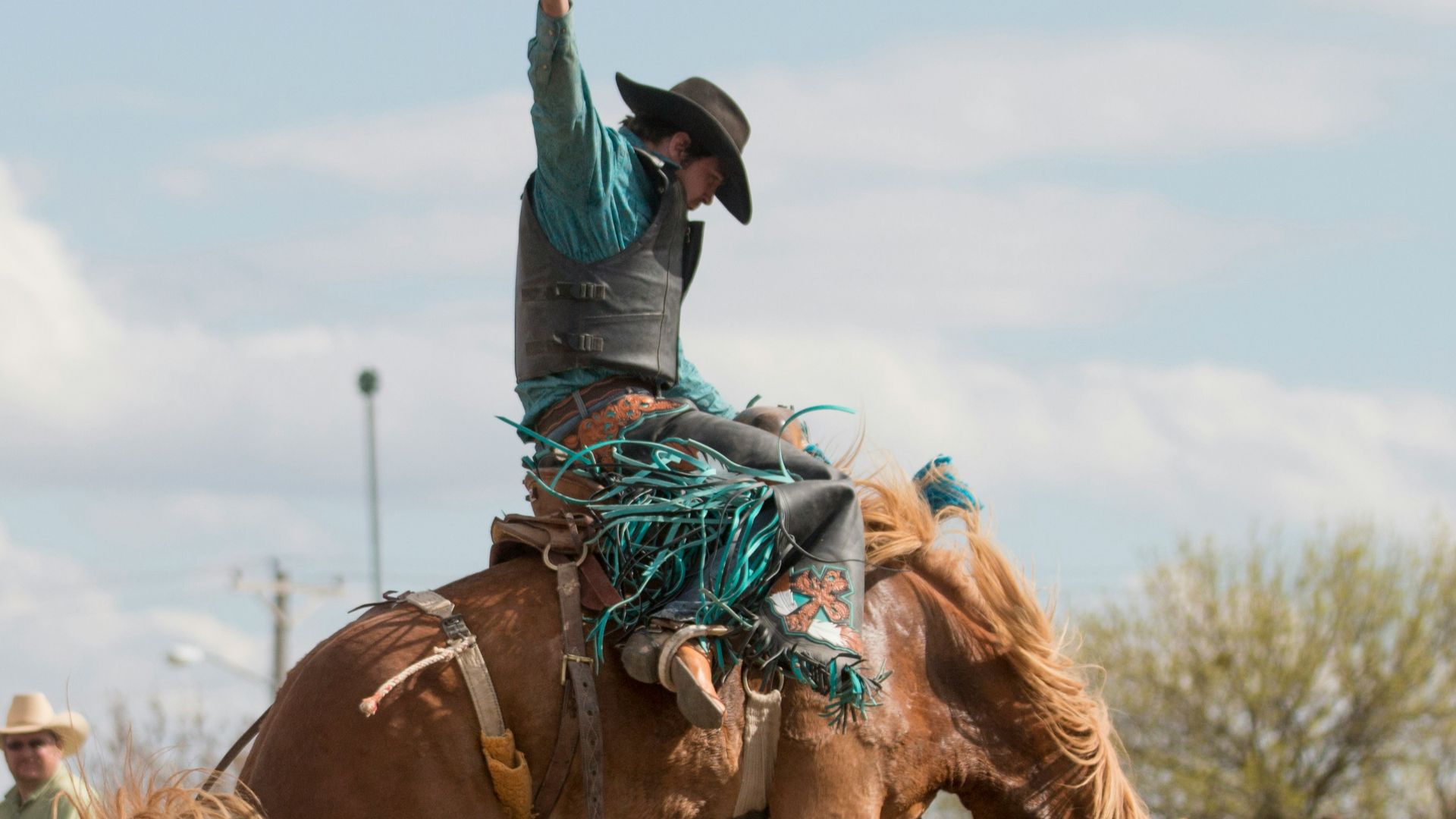 man riding brown horse during daytime