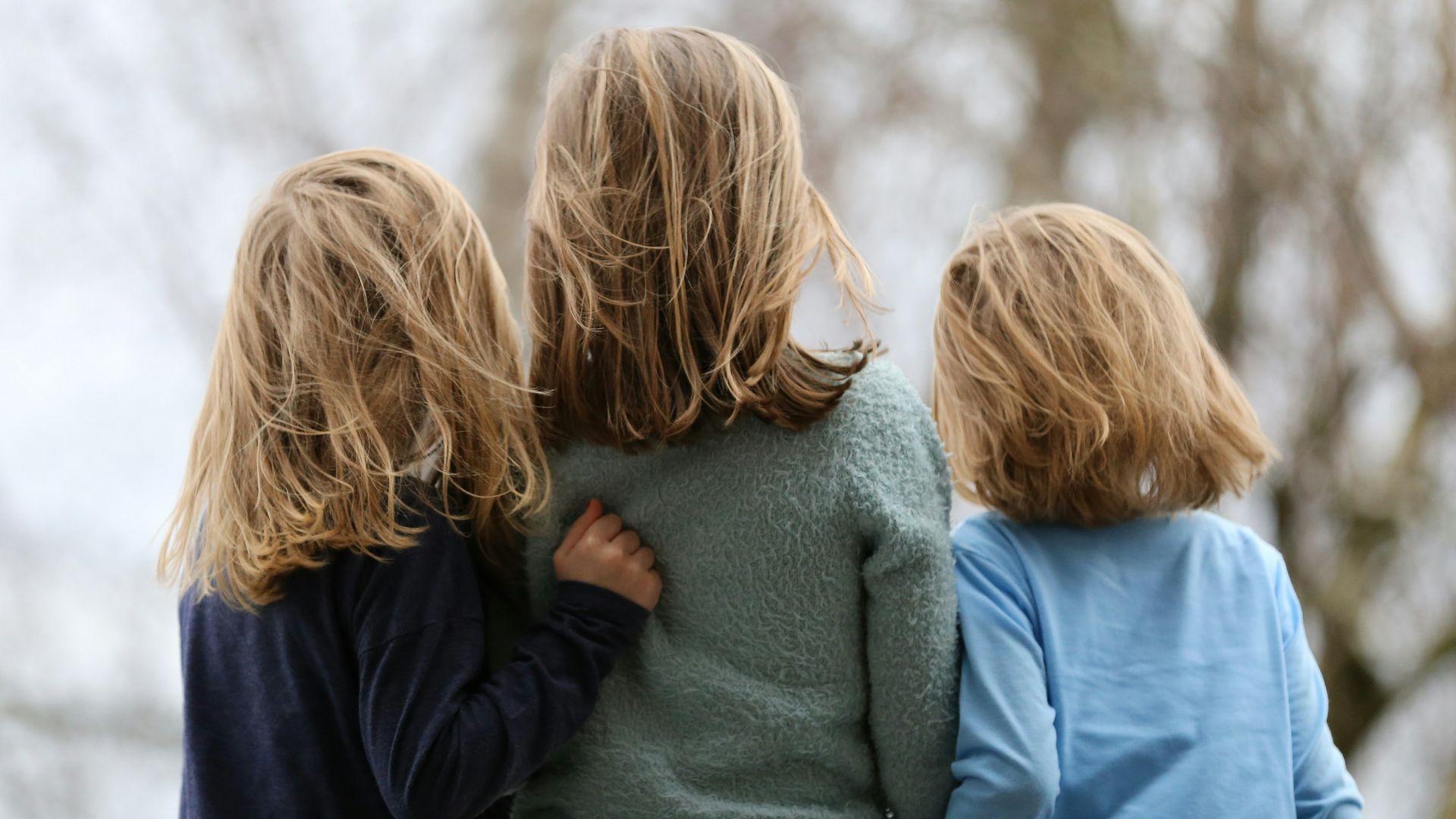 2 women in blue and gray sweaters
