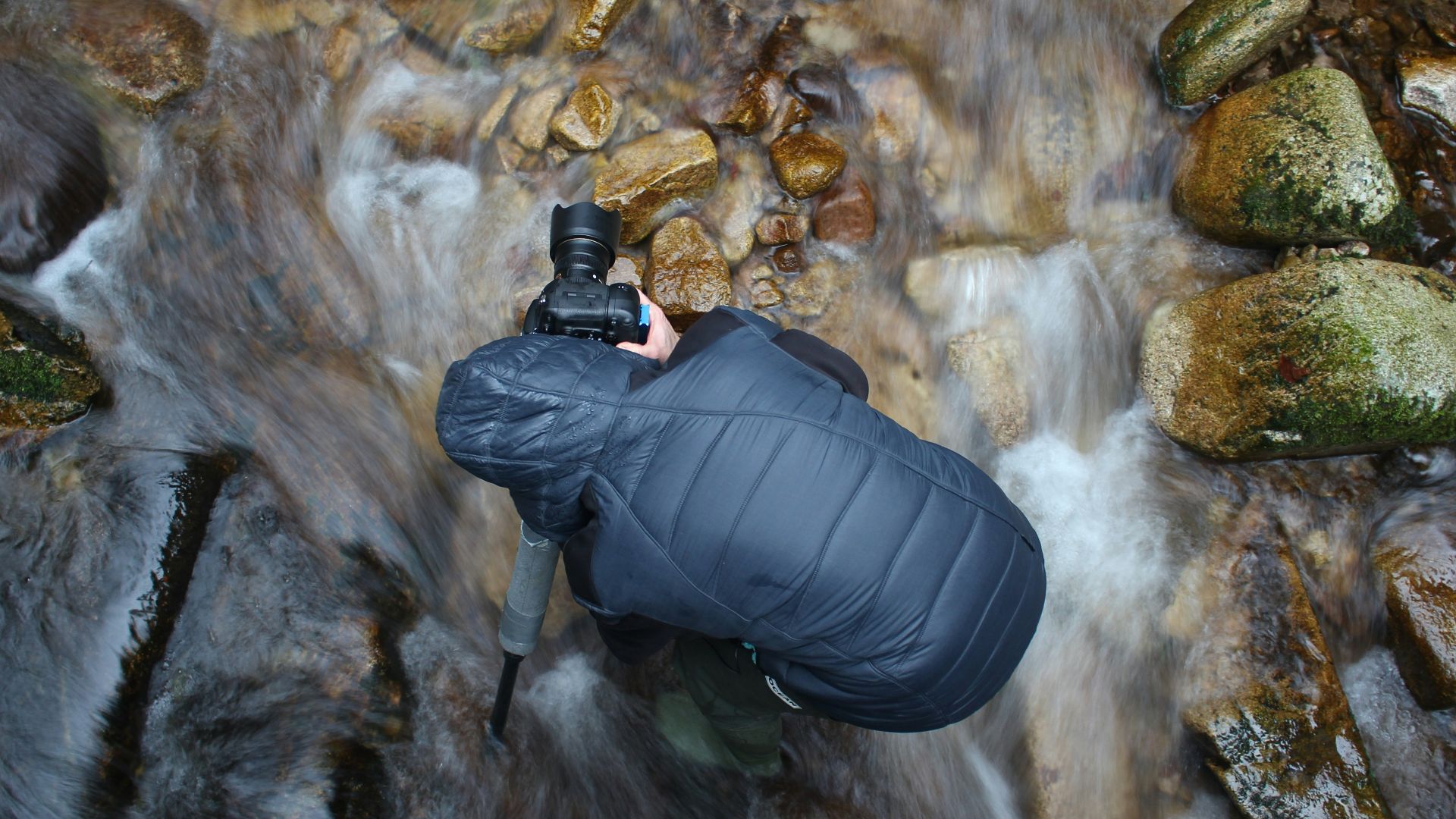 man standing on stream