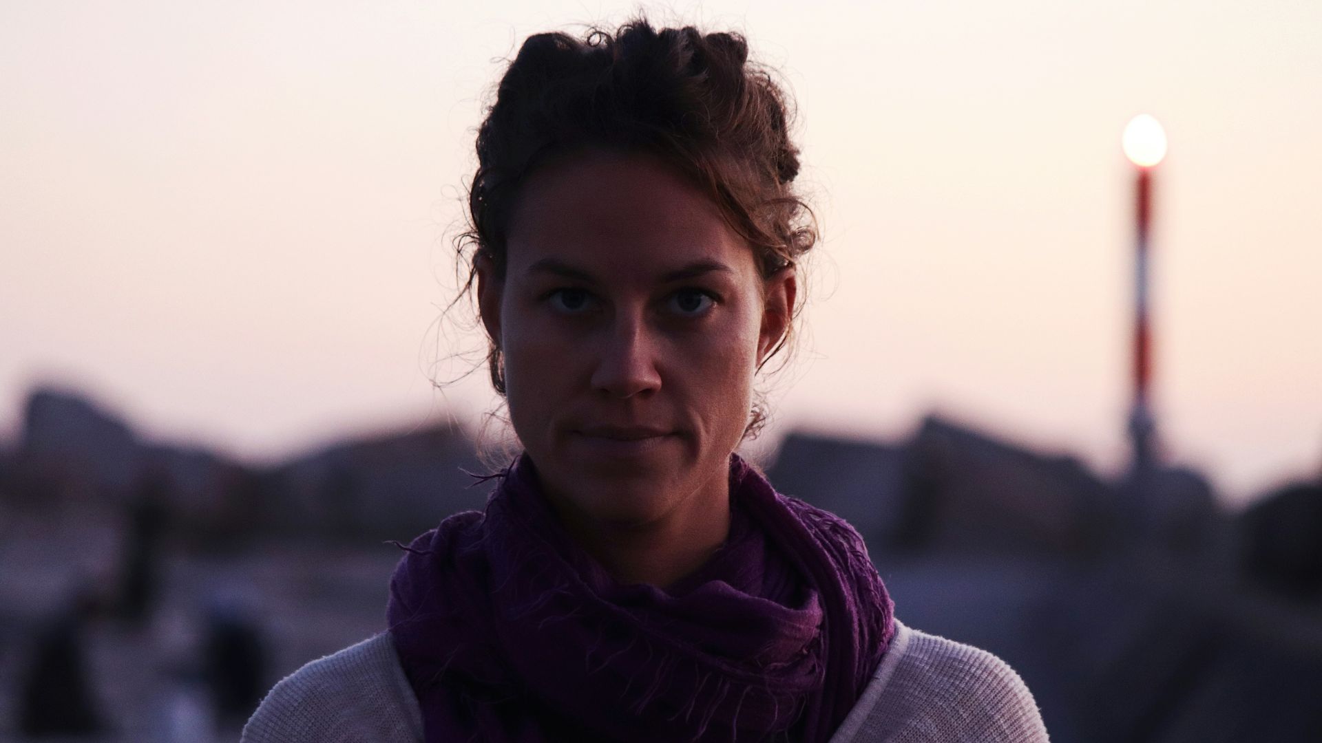 a woman with a scarf around her neck