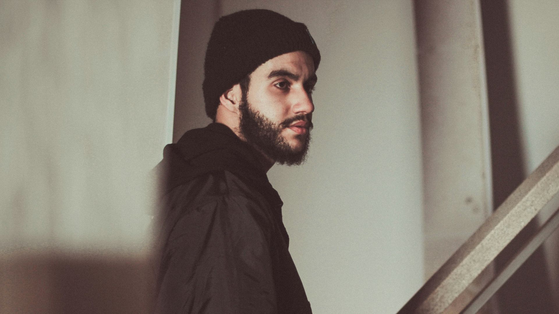 man standing near staircase