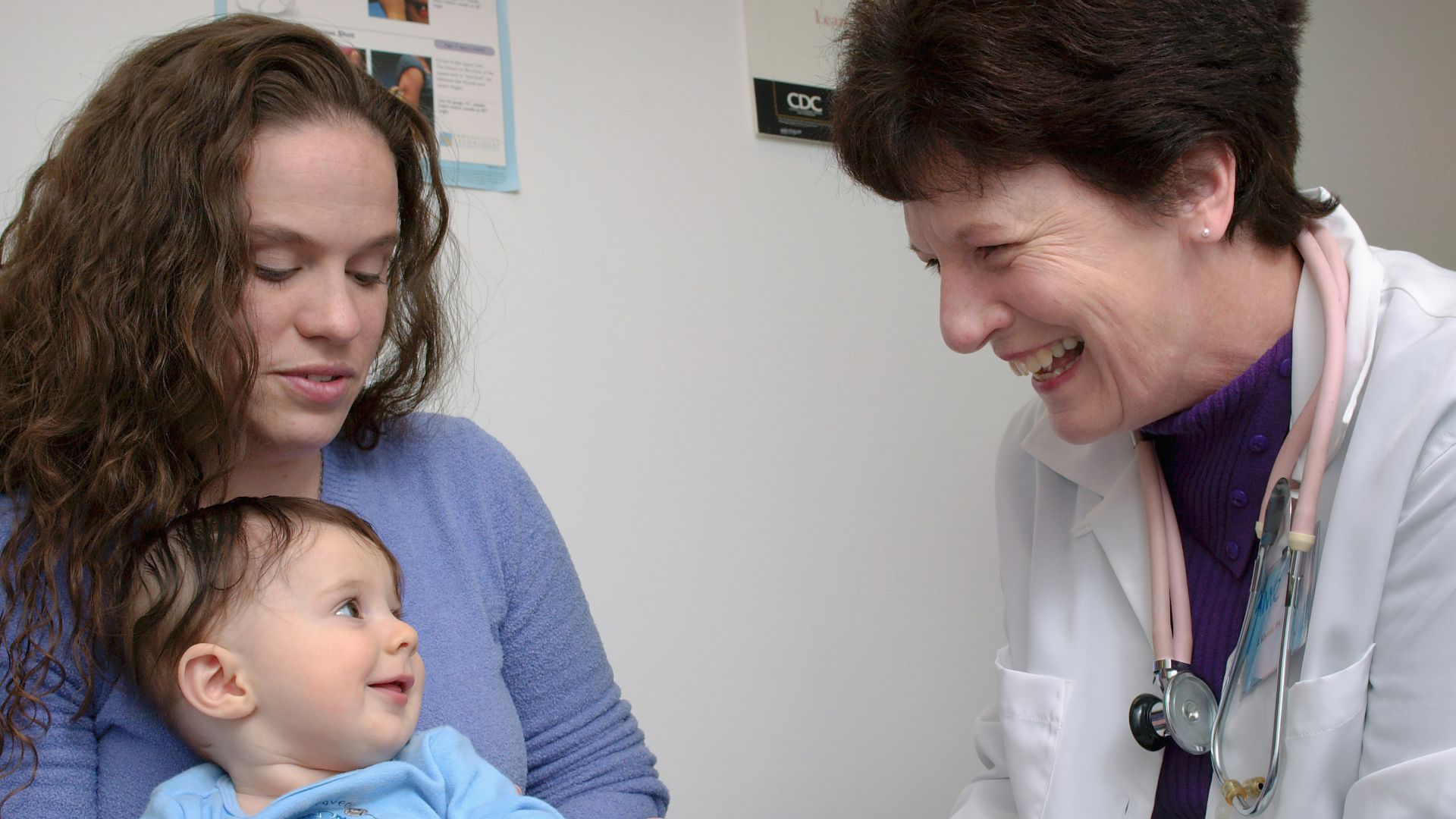 a young child is being examined by a doctor