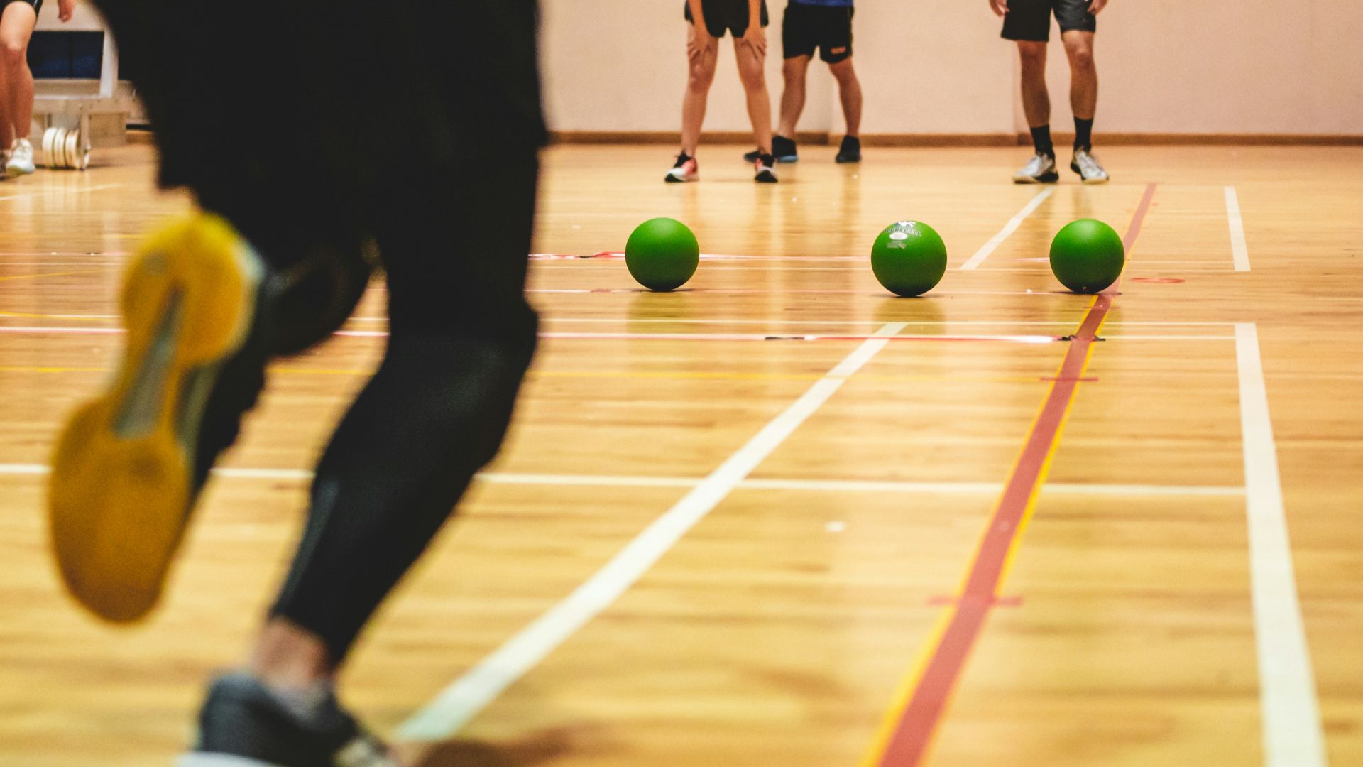people playing soccer on field