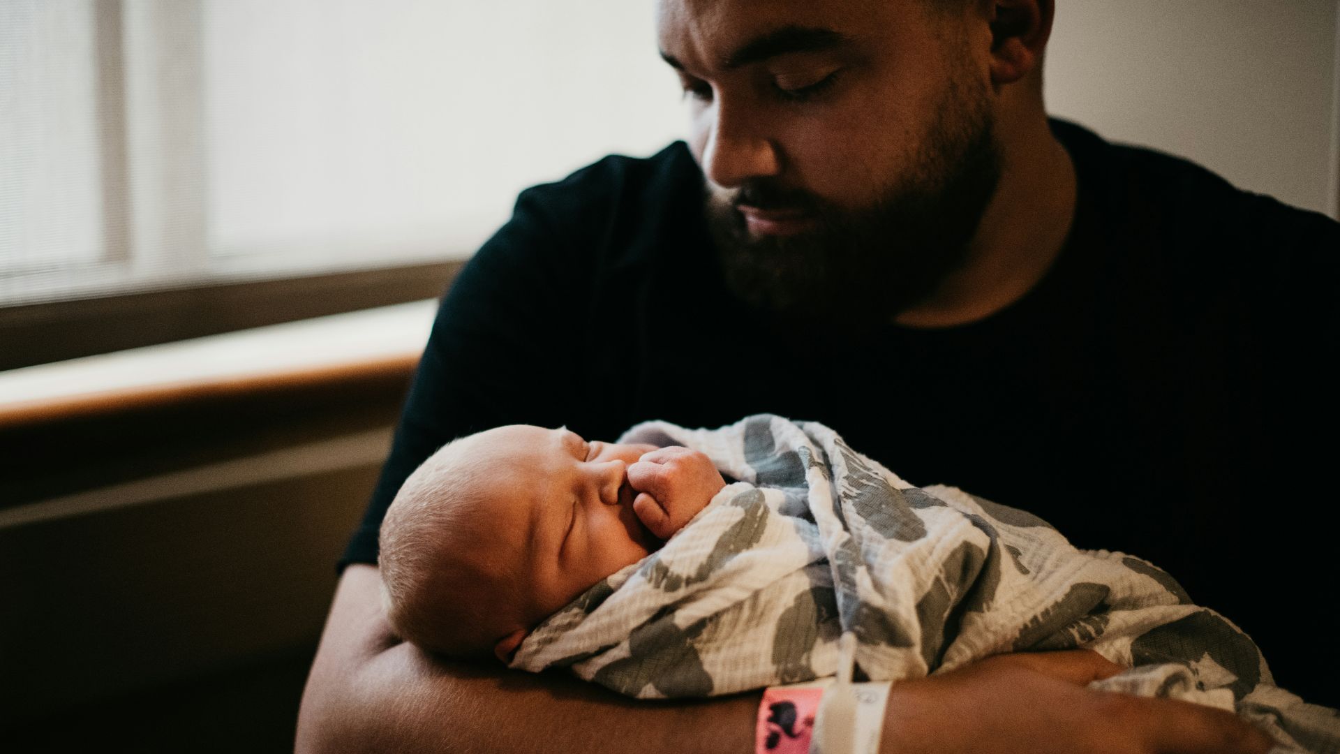 a man holding a baby