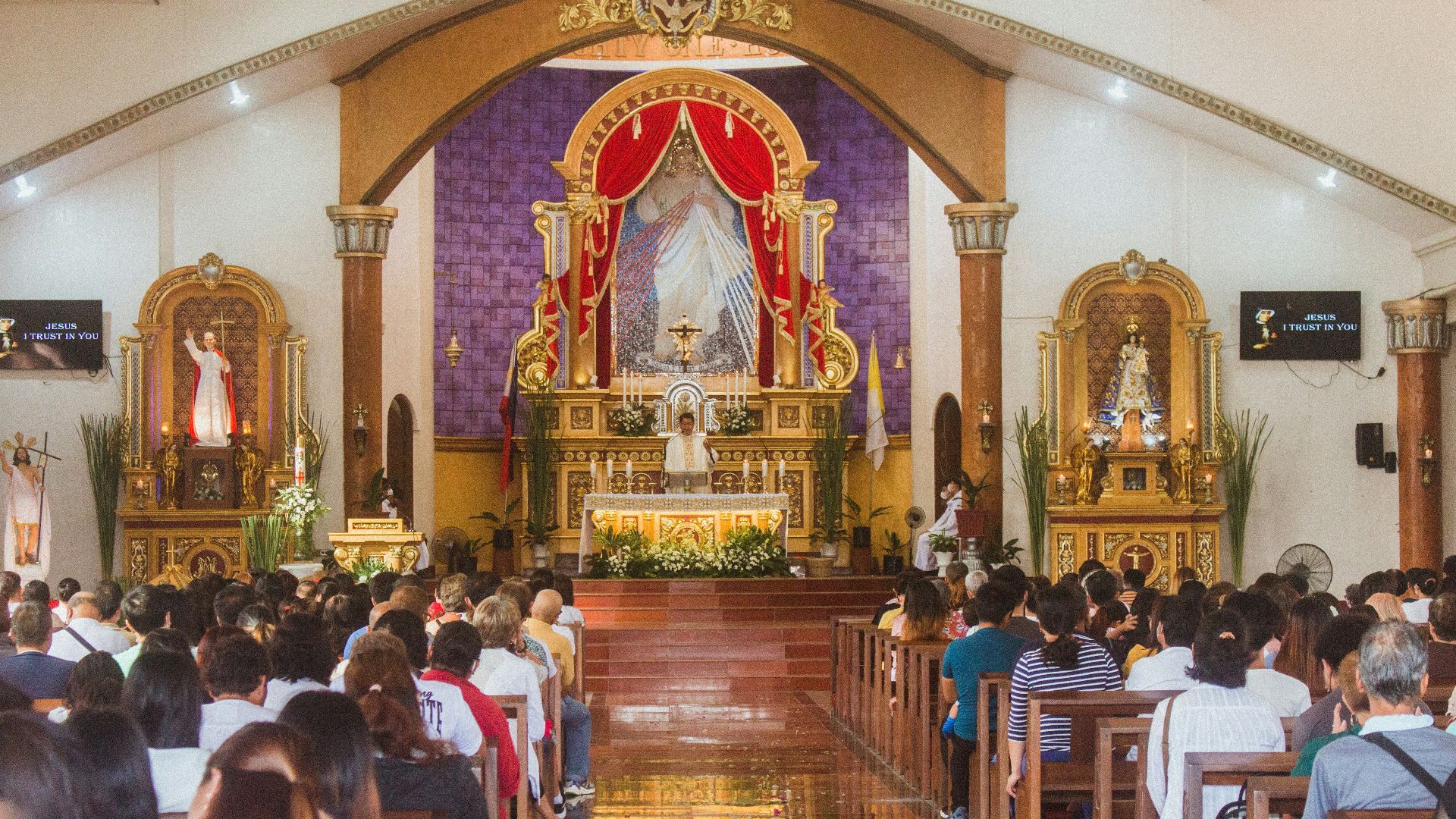 a large group of people sitting in a church