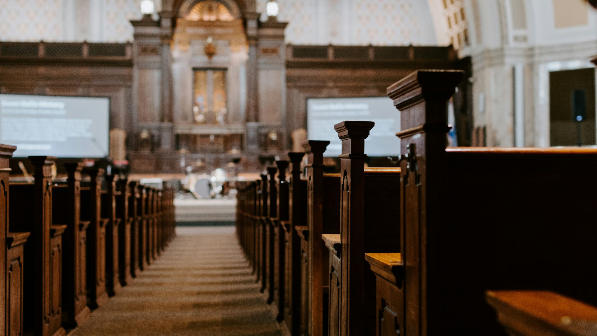 brown wooden benches inside building