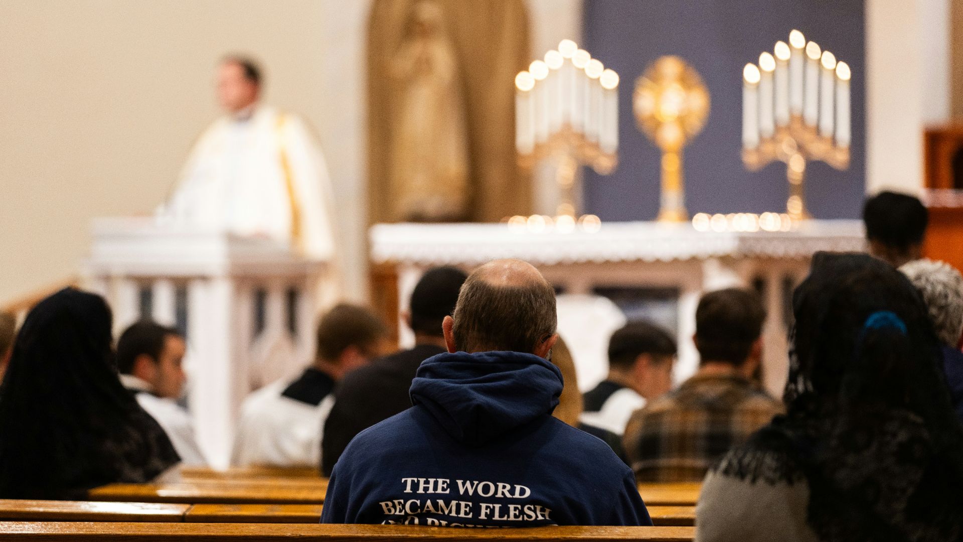 A group of people sitting in a church