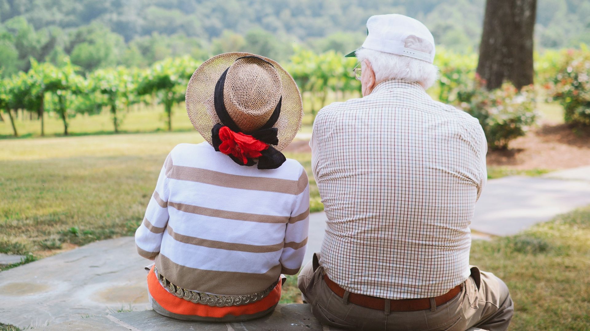 couple sitting on pathway