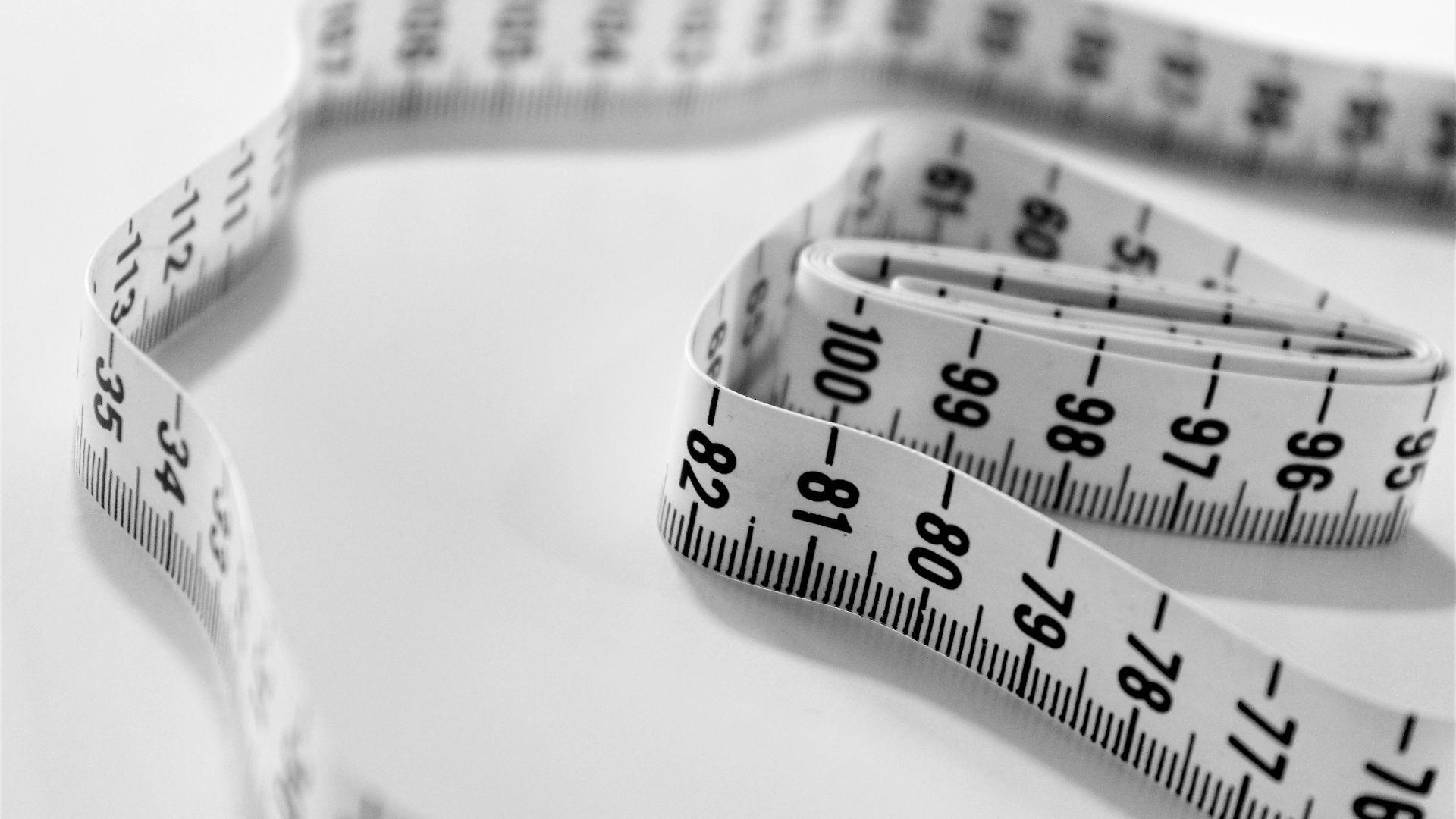 selective focus photography of tape measure